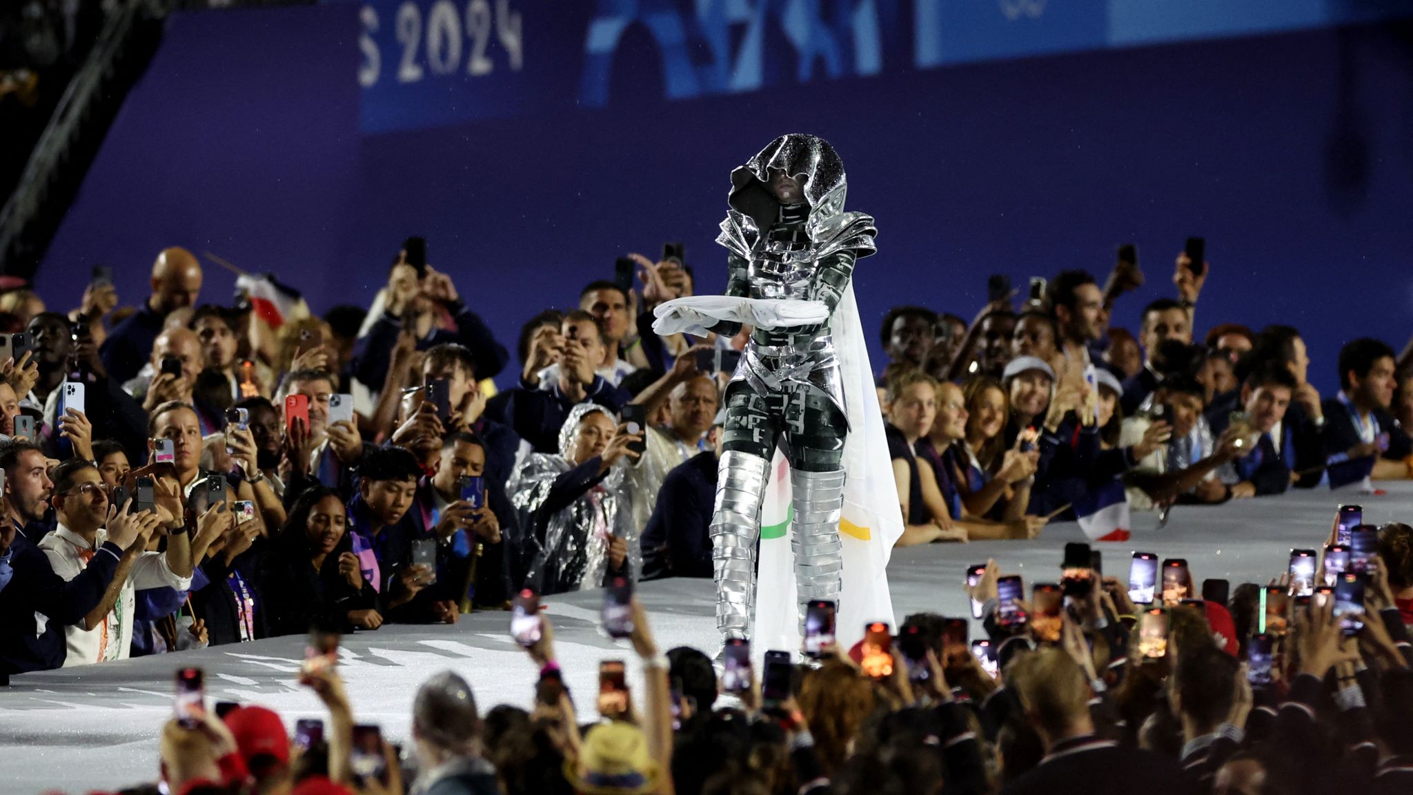 The Olympic flag is carried on the Trocadero during the opening ceremony. Pic: Reuters