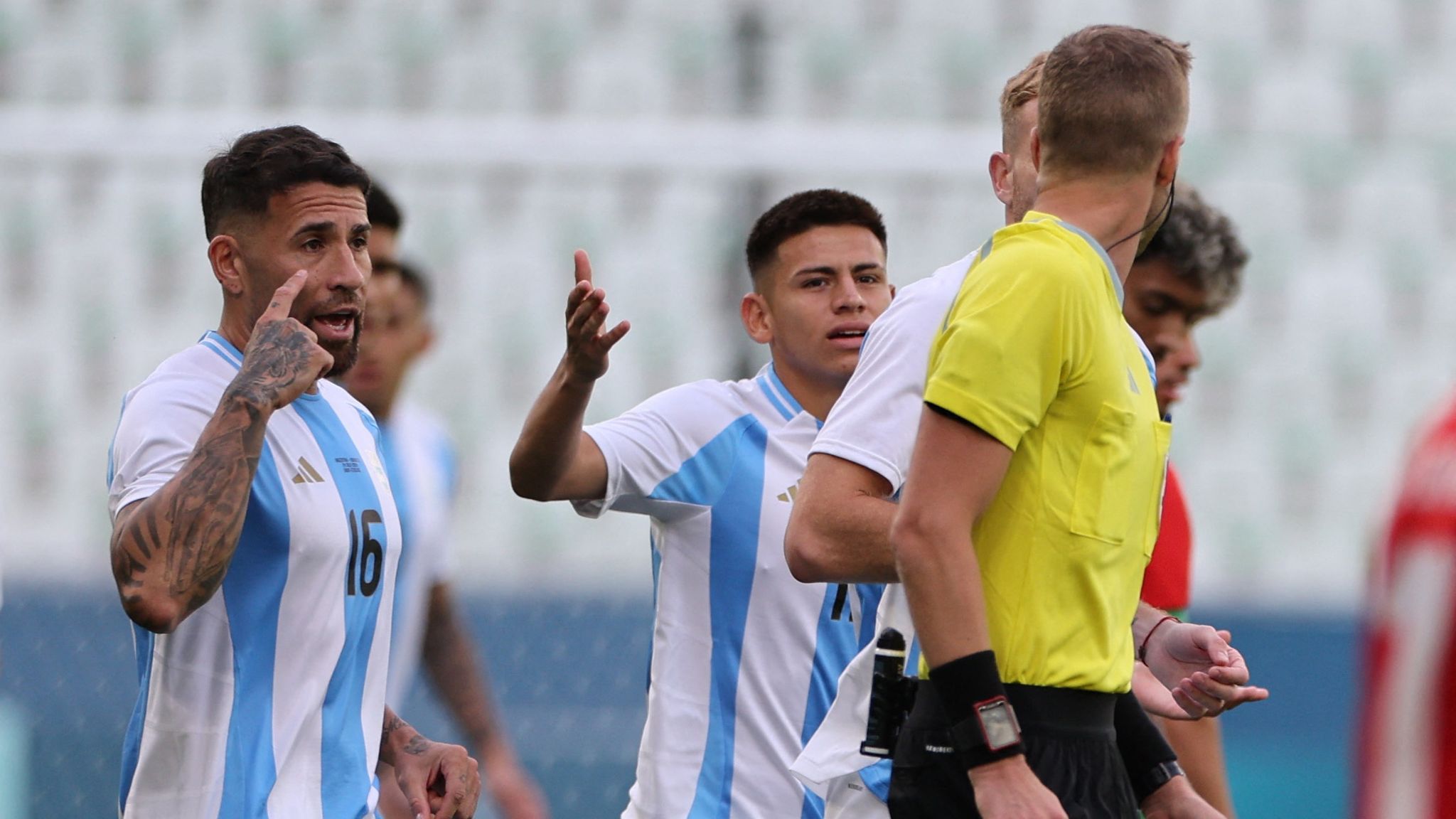 Argentina players speak to the referee during the match. Pic: Reuters