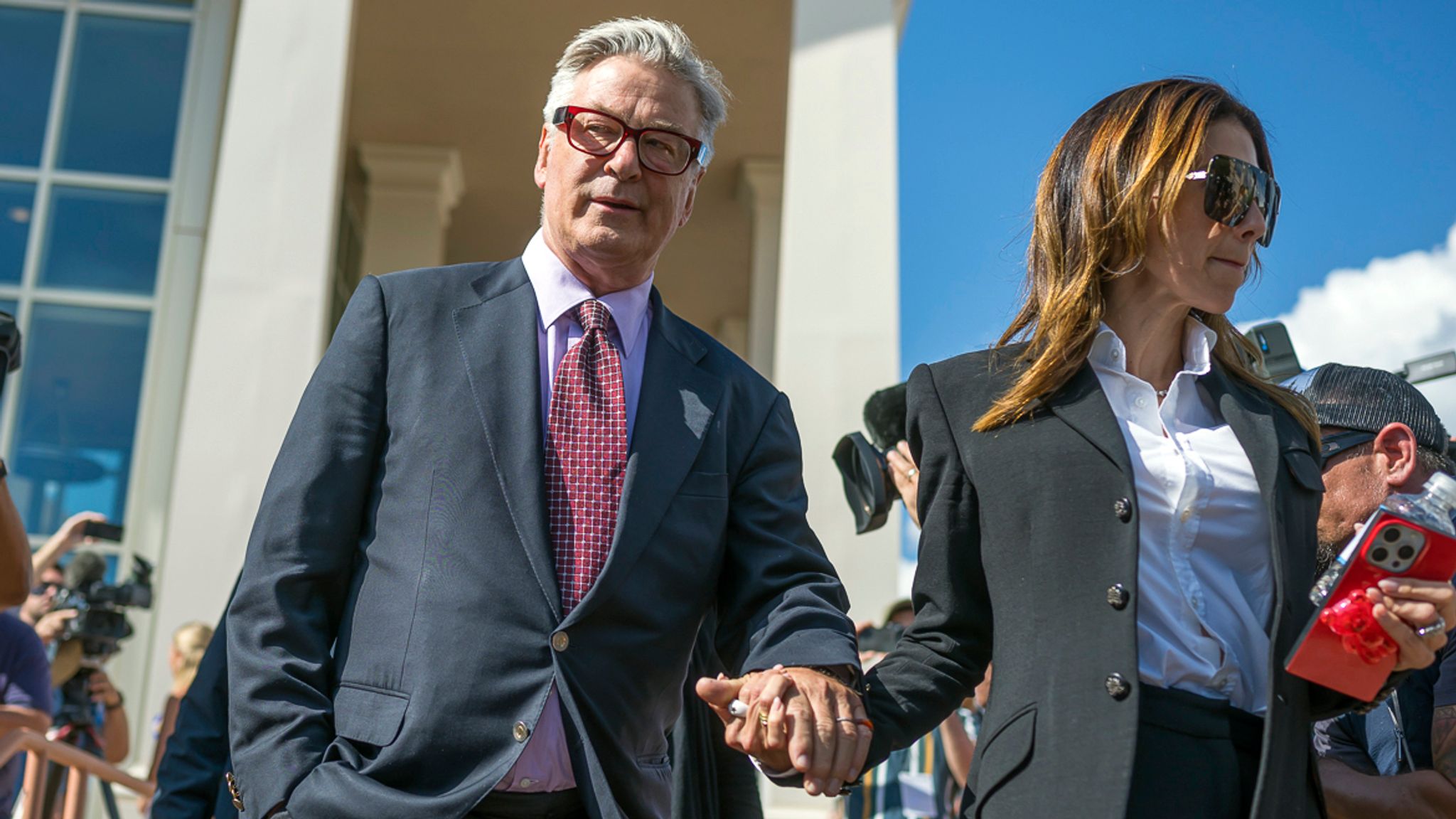 Actor Alec Baldwin and his wife Hilaria Baldwin leave District Court, Wednesday, July 10, 2024, following the day's proceedings in his involuntary manslaughter trial in Santa Fe, N.M. (AP Photo/Roberto E. Rosales)