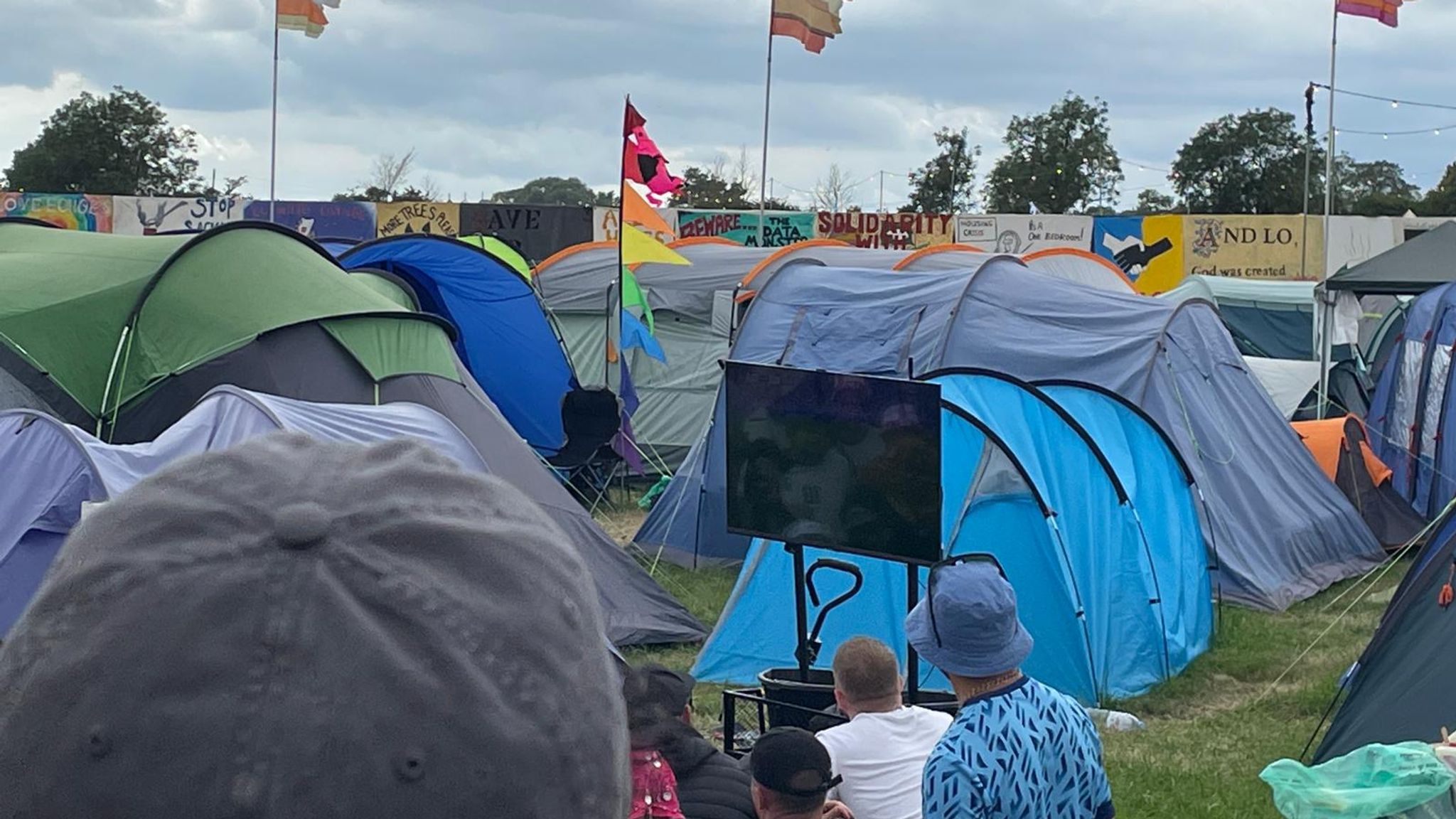 One Direction star Louis Tomlinson took a TV to Glastonbury to watch the England v Slovakia match