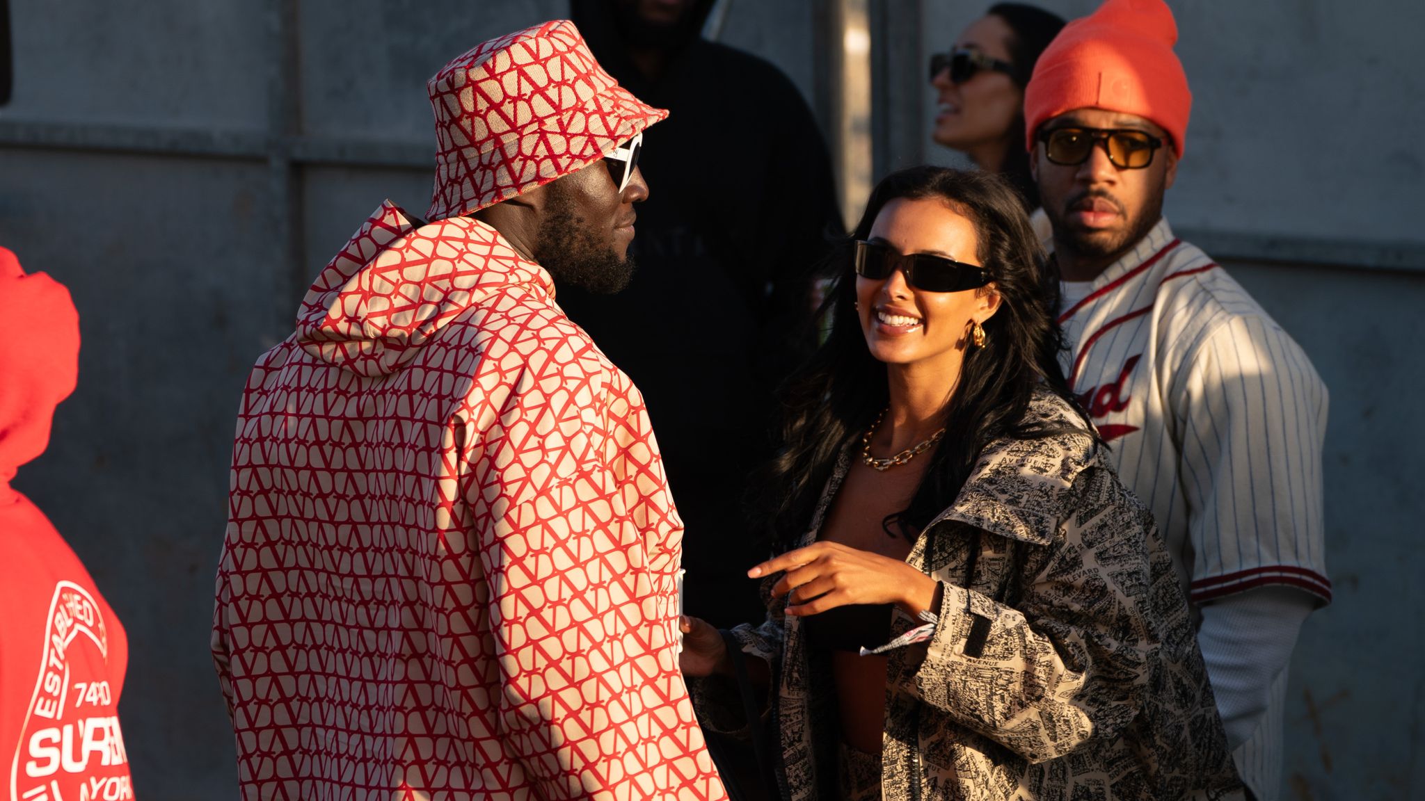 Stormzy and Maya Jama watch D-Block Europe from the side of the other stage at Glastonbury Festival. Pic: Ben Birchall/PA