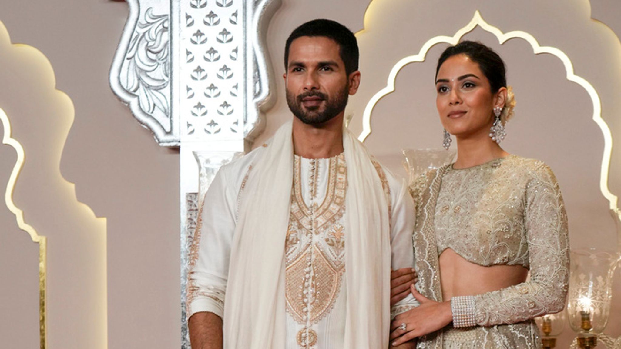 Indian actor Shahid Kapoor poses for a photograph with his wife Mira Rajput. Pic: AP