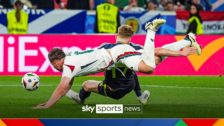 Scotland&#39;s Stuart Armstrong is brought down by Hungary&#39;s Willi Orban