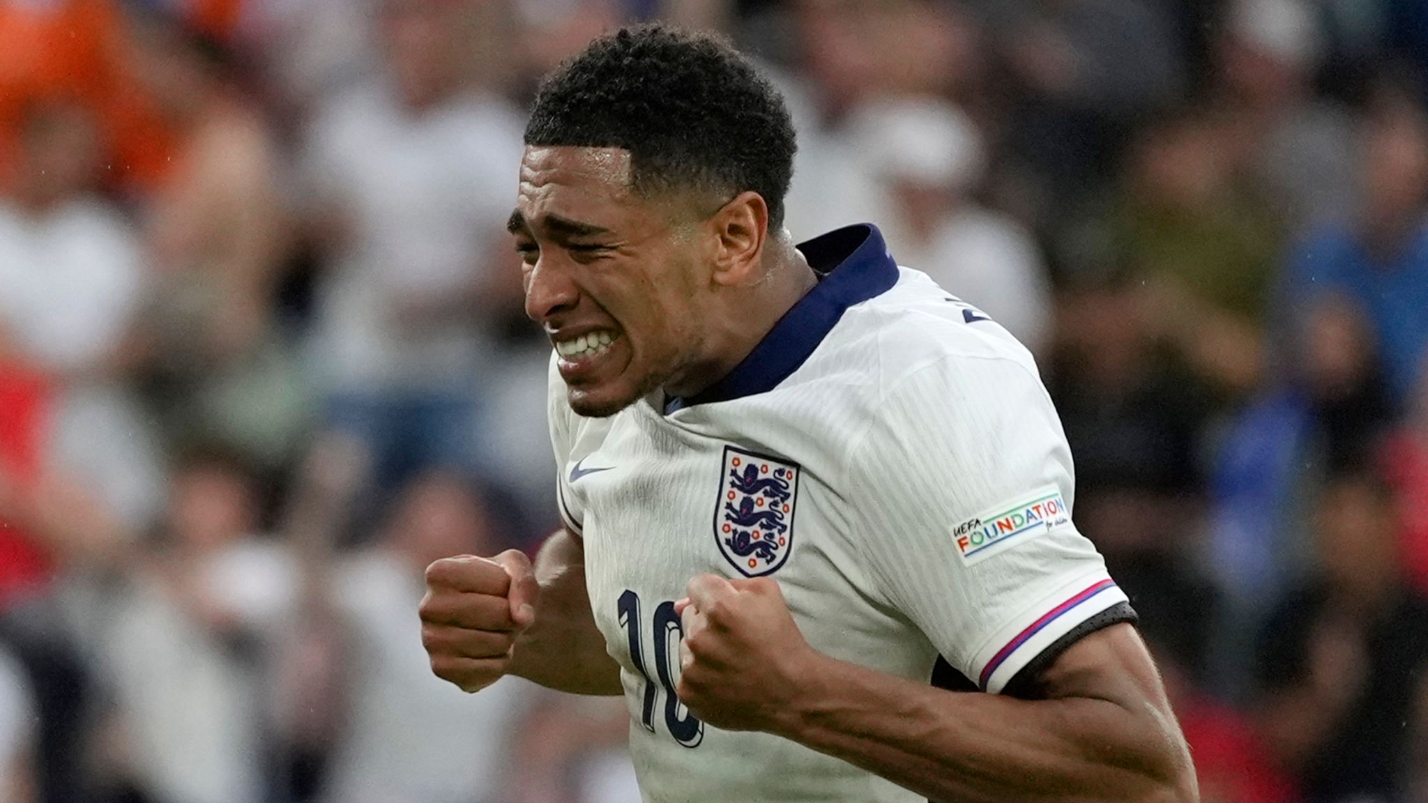 England's Jude Bellingham celebrates after his teammate Harry Kane scores his side's second goal during a round of sixteen match between England and Slovakia at the Euro 2024 soccer tournament in Gelsenkirchen, Germany, Sunday, June 30, 2024. (AP Photo/Antonio Calanni)