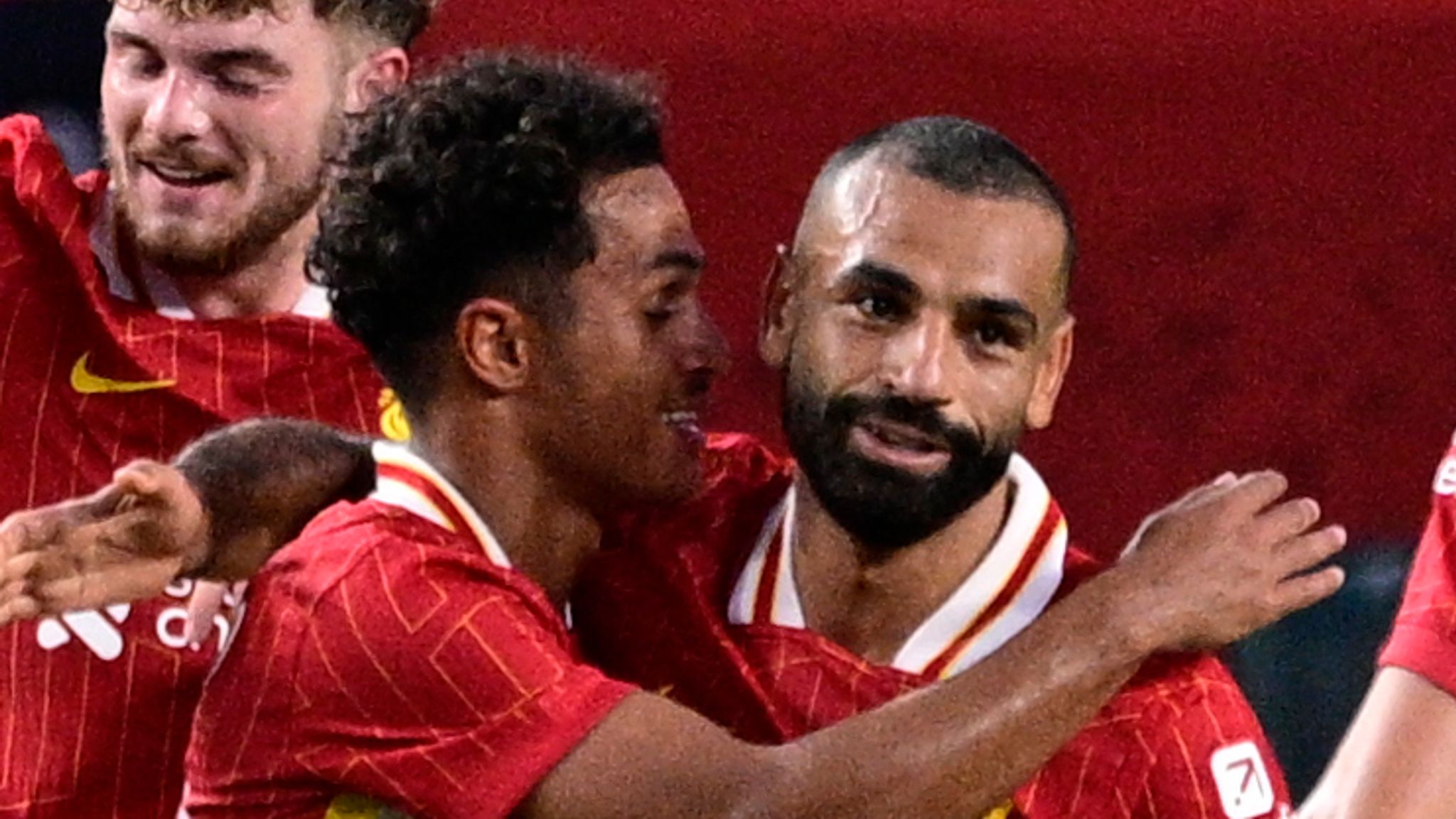 Liverpool's Fabio Carvalho, center left, celebrates his goal with Mohamed Salah (11) during the first half of an international friendly soccer match against Arsenal, Wednesday, July 31, 2024, in Philadelphia. (AP Photo/Derik Hamilton)