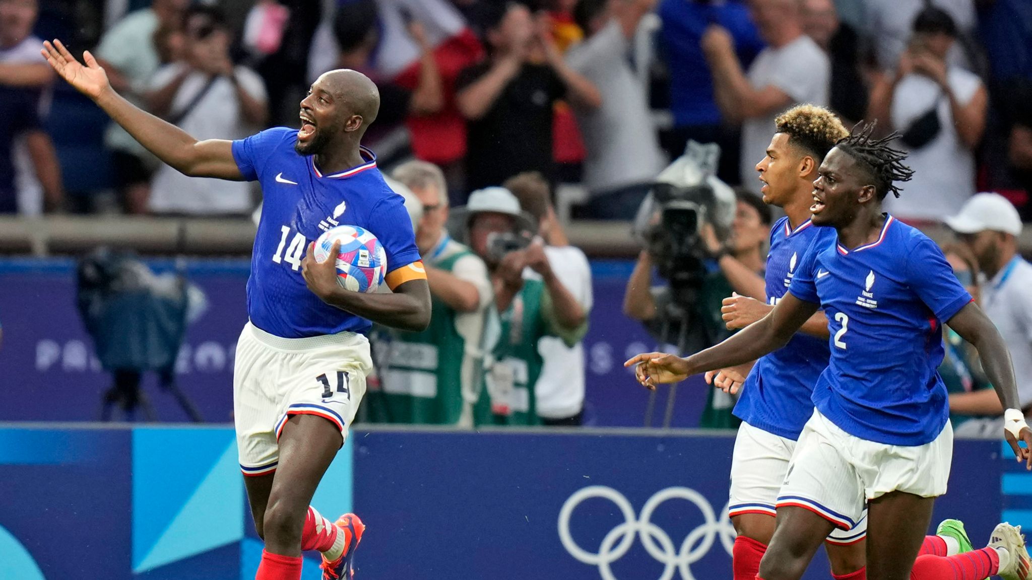 France's Jean-Philippe Mateta celebrates after scoring his team's third goal during the men's soccer gold medal match between France and Spain at the Parc des Princes during the 2024 Summer Olympics, Friday, Aug. 9, 2024, in Paris, France. (AP Photo/Francisco Seco)