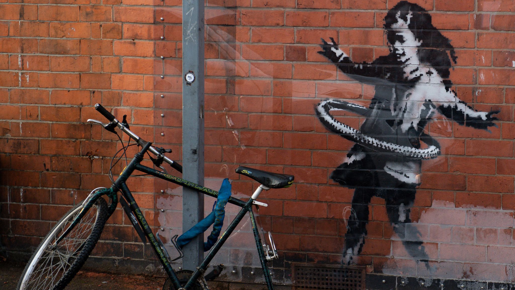 This Banksy was removed and sold to an art gallery. Pic: PA