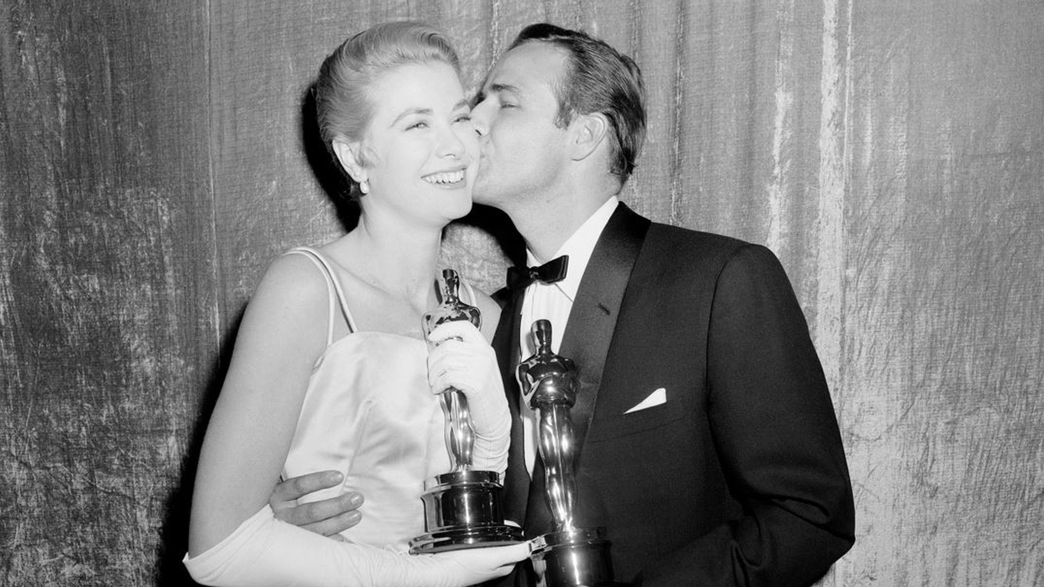 Grace Kelly and Marlon Brando with their Oscars in 1955 Pic: AP 