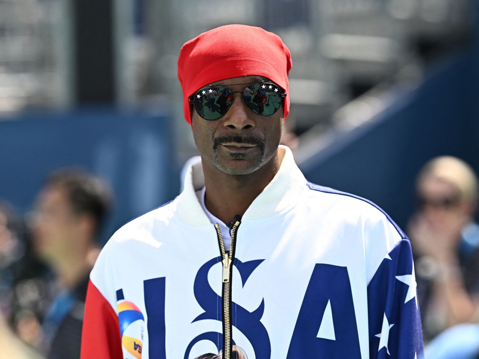 U.S. rapper Snoop Dogg looks on as he arrives at Eiffel Tower Stadium, Paris, France - July 31, 2024. REUTERS/Dylan Martinez