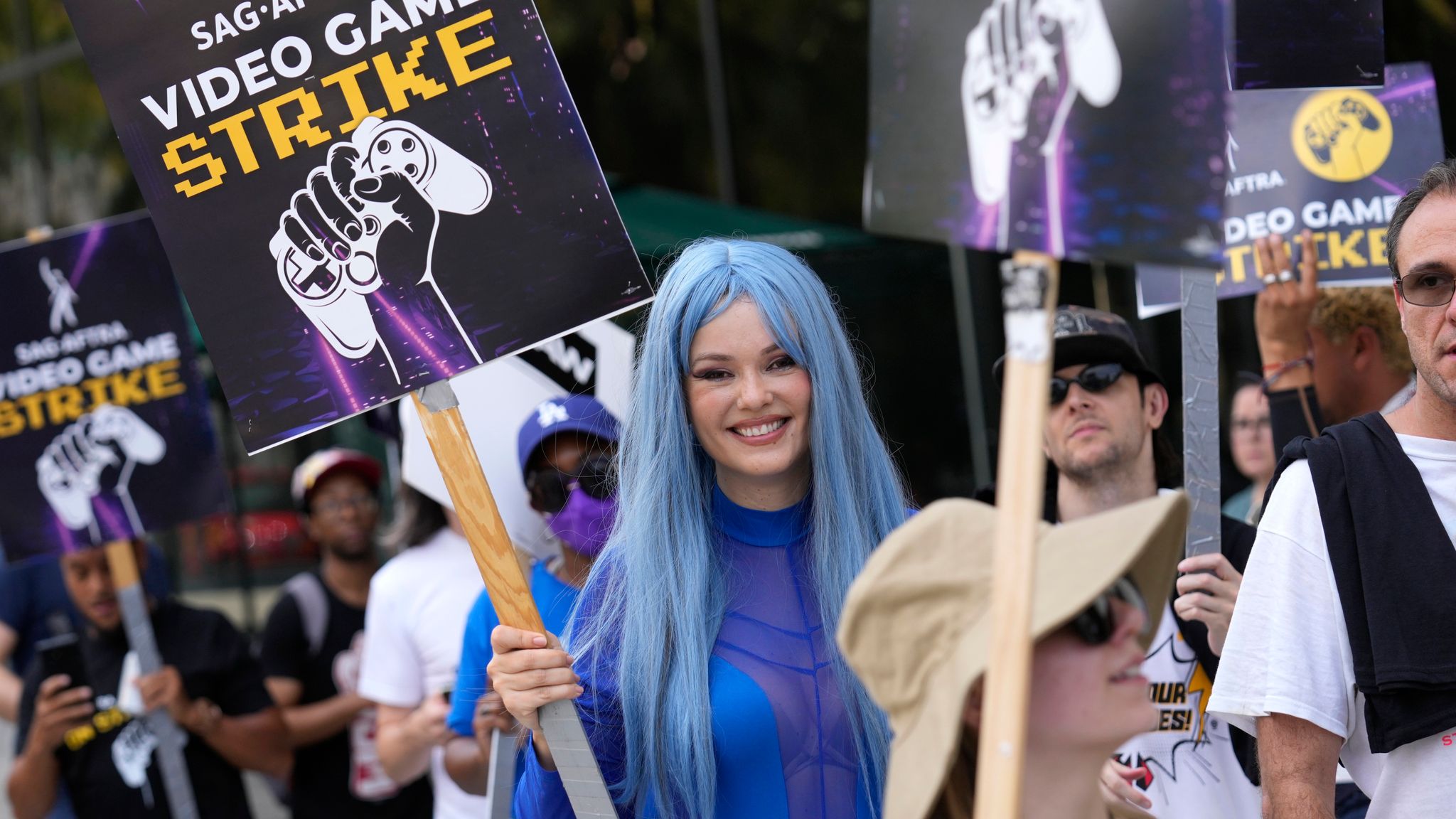 Actor Natasha Blasick on the picket line at Warner Bros. Games headquarters. Pic: AP