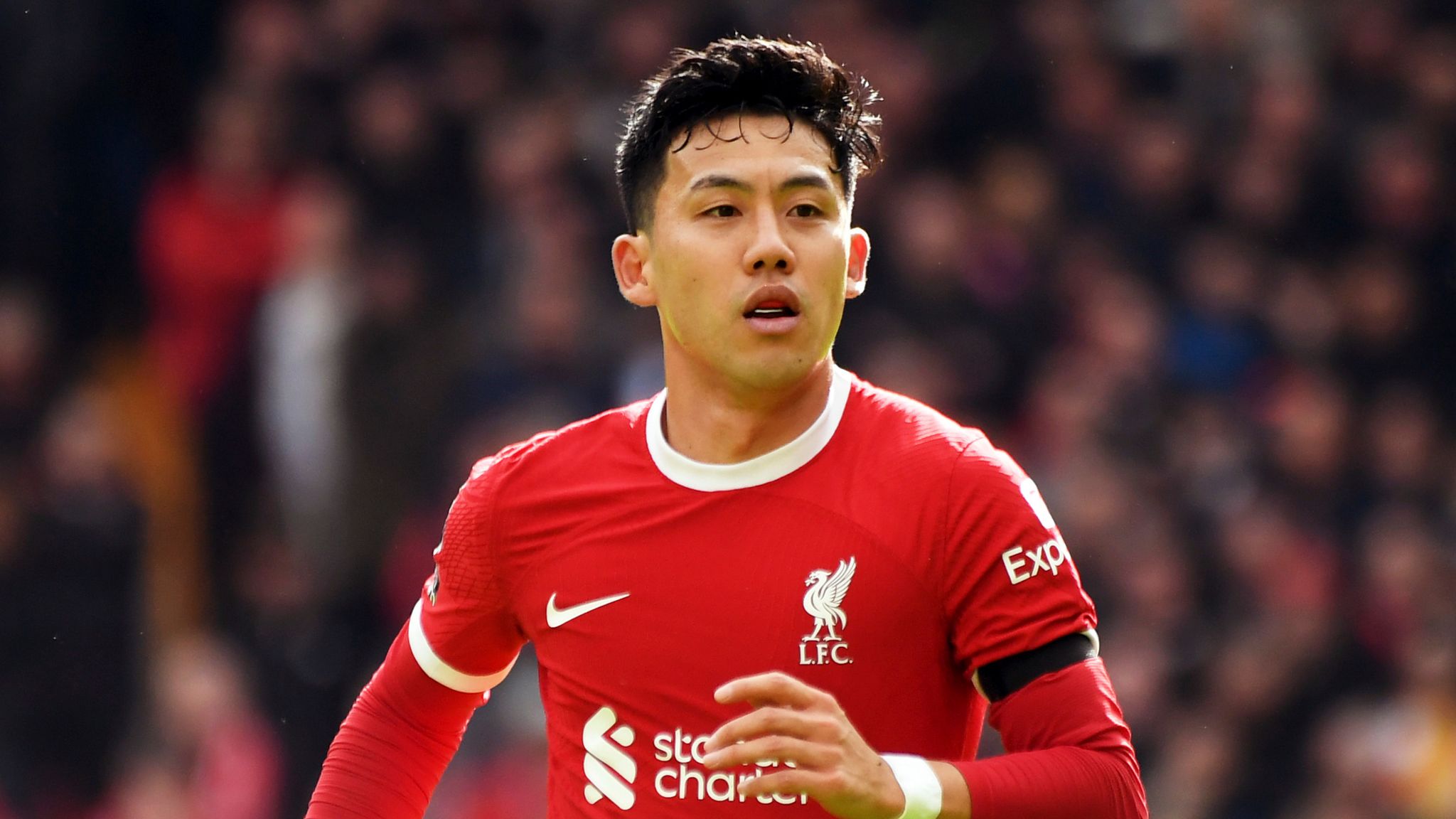 Liverpool's Wataru Endo during the English Premier League soccer match between Liverpool and Brighton & Hove Albion at Anfield, in Liverpool, England, Sunday March 31, 2024. (AP Photo/Rui Vieira)