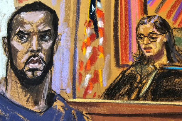 Sean "Diddy" Combs stands before U.S. Magistrate Judge Robyn Tarnofsky after prosecutors brought three criminal charges against him in federal court in the Manhattan borough of New York City, Sept. 17, 2024, in a courtroom sketch. 