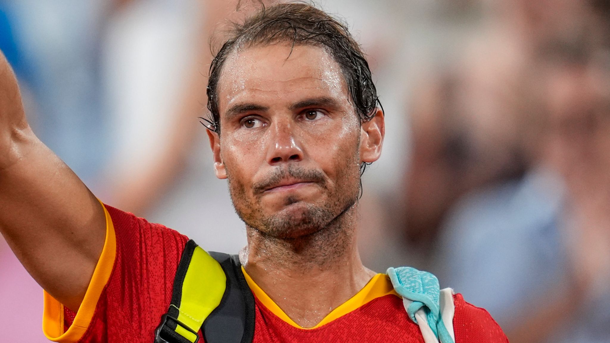 Rafael Nadal reacts waves after losing with his teammate Carlos Alcaraz of Spain against Austin Krajicek and Rajeev Ram of the USA during the men's doubles quarter-final tennis competition at the Roland Garros stadium, at the 2024 Summer Olympics, Wednesday, July 31, 2024, in Paris, France. (AP Photo/Manu Fernandez)