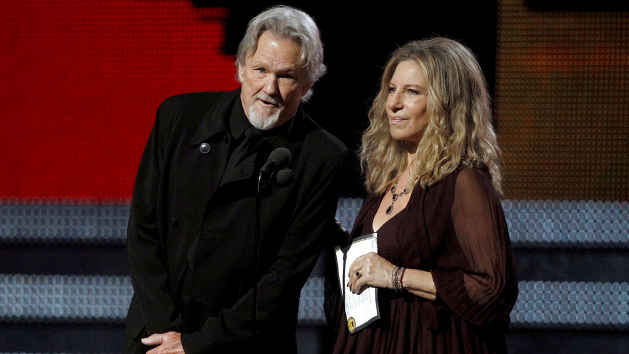 Kris Kristofferson, left, and Barbra Streisand present the award for album of the year at the 53rd annual Grammy Awards on Sunday, Feb. 13, 2011, in Los Angeles. (AP Photo/Matt Sayles)