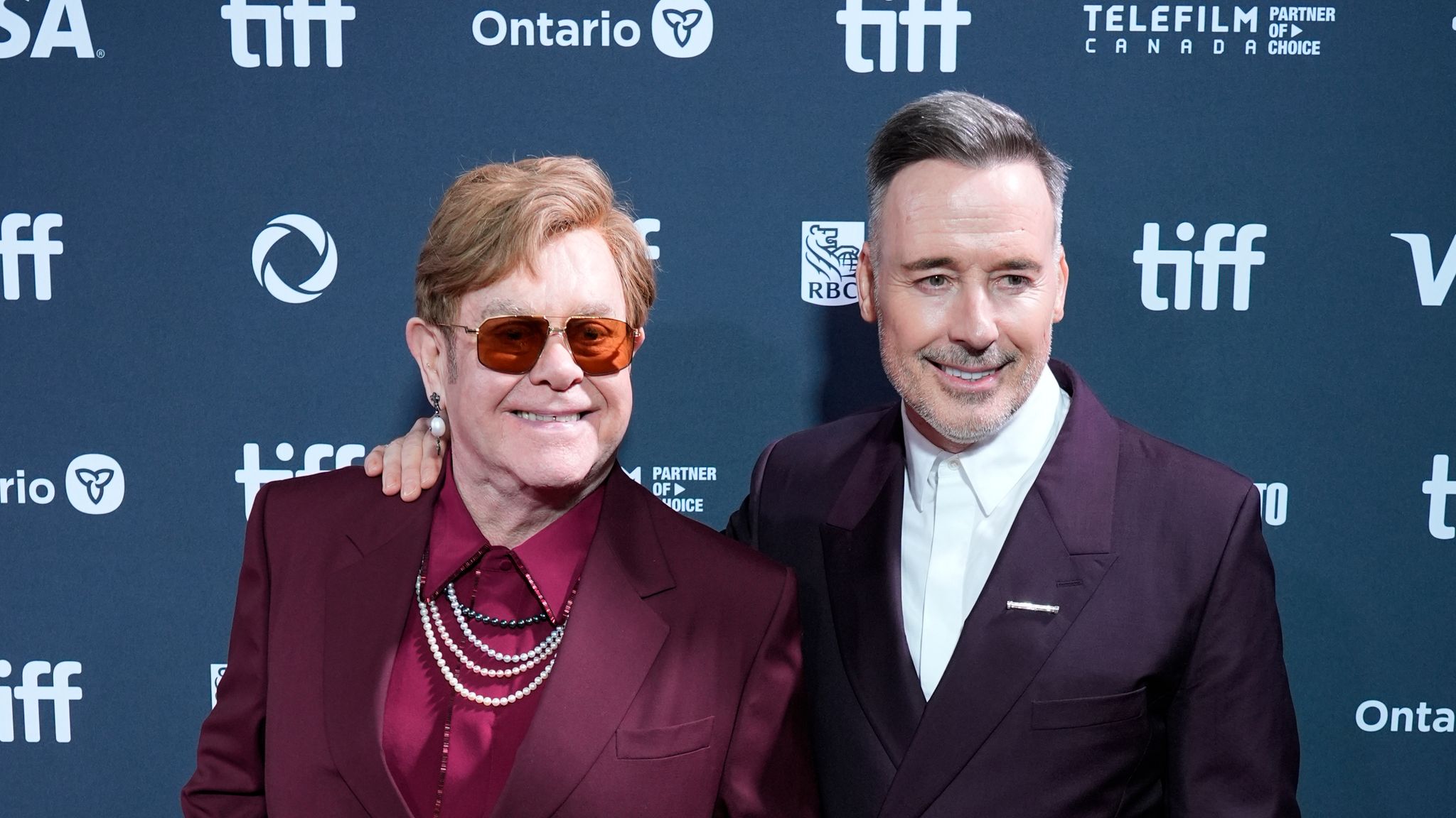 Elton John, left, and David Furnish attend the premiere of "Elton John: Never Too Late" during the Toronto International Film Festival on Friday, Sept. 6, 2024, at Roy Thomson Hall in Toronto. (AP Photo/Chris Pizzello)