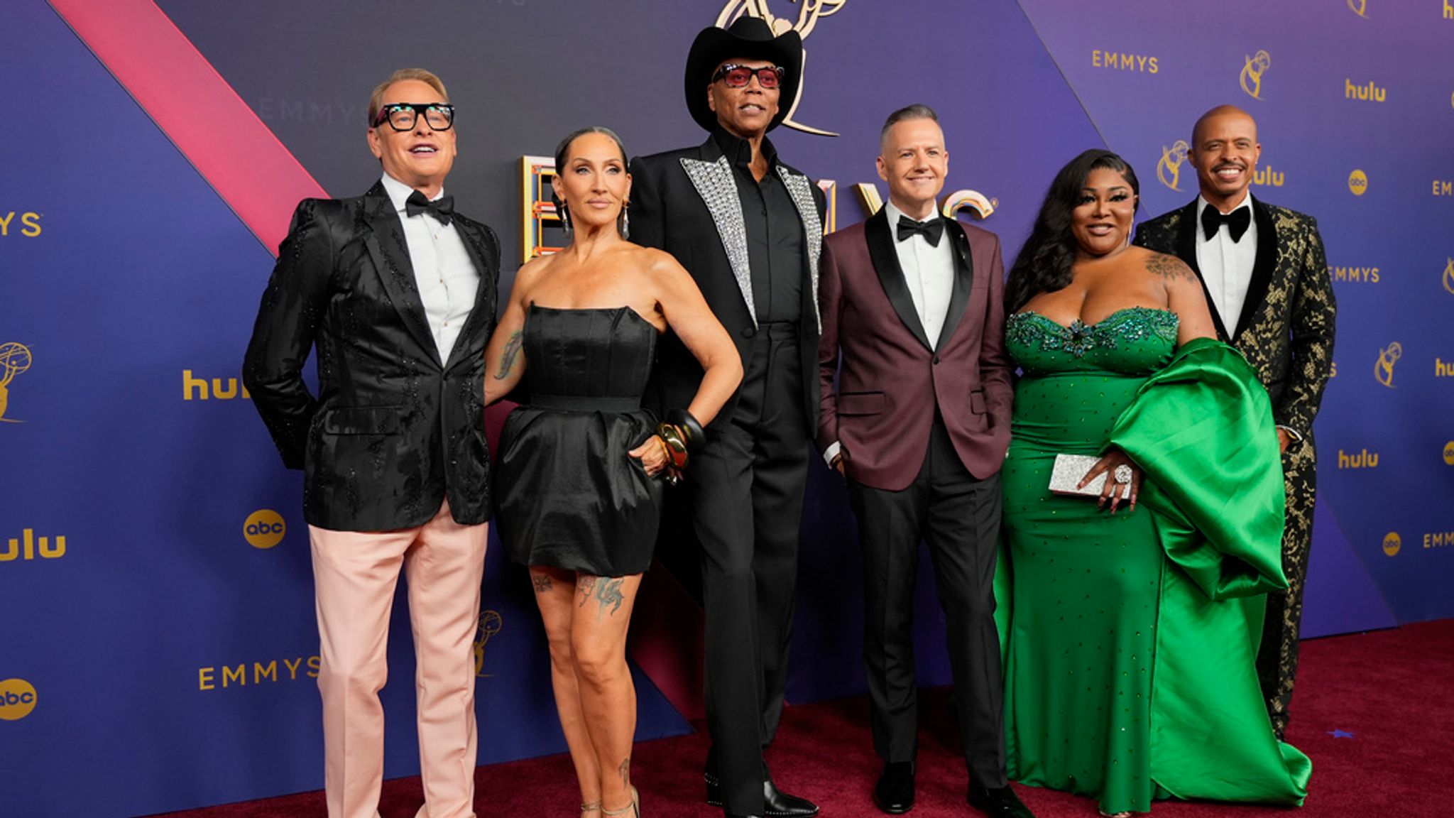 Carson Kressley, from left, Michelle Visage, RuPaul, Ross Mathews, Ts Madison and Jamal Sims arrive at the 76th Primetime Emmy Awards on Sunday, Sept. 15, 2024, at the Peacock Theater in Los Angeles. (AP Photo/Jae C. Hong)