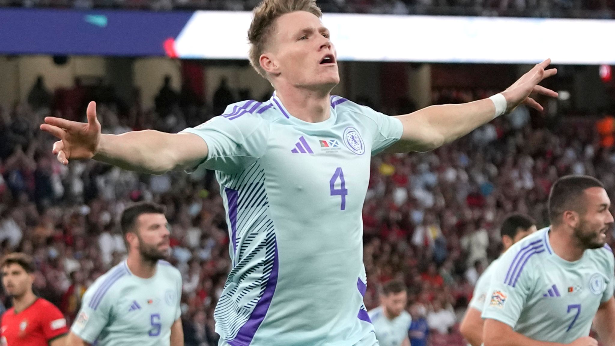 Scotland's Scott McTominay celebrates after scoring the opening goal during the UEFA Nations League soccer match between Portugal and Scotland at the Luz stadium in Lisbon, Portugal, Sunday, Sept. 8, 2024. (AP Photo/Armando Franca)