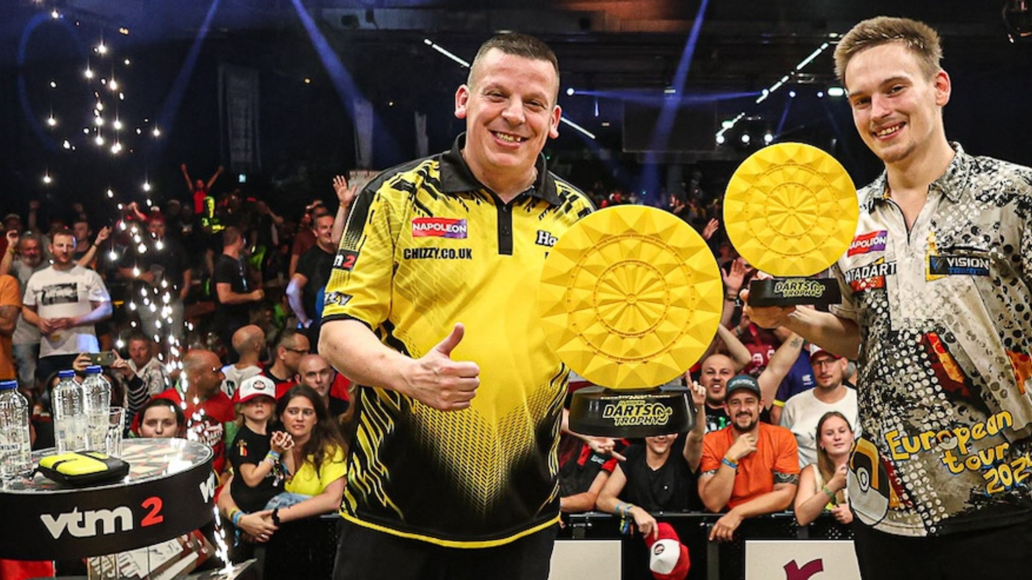 Dave Chisnall celebrates his Flanders Darts Trophy victory, with runner-up Ricardo Pietreczko (PDC Europe)