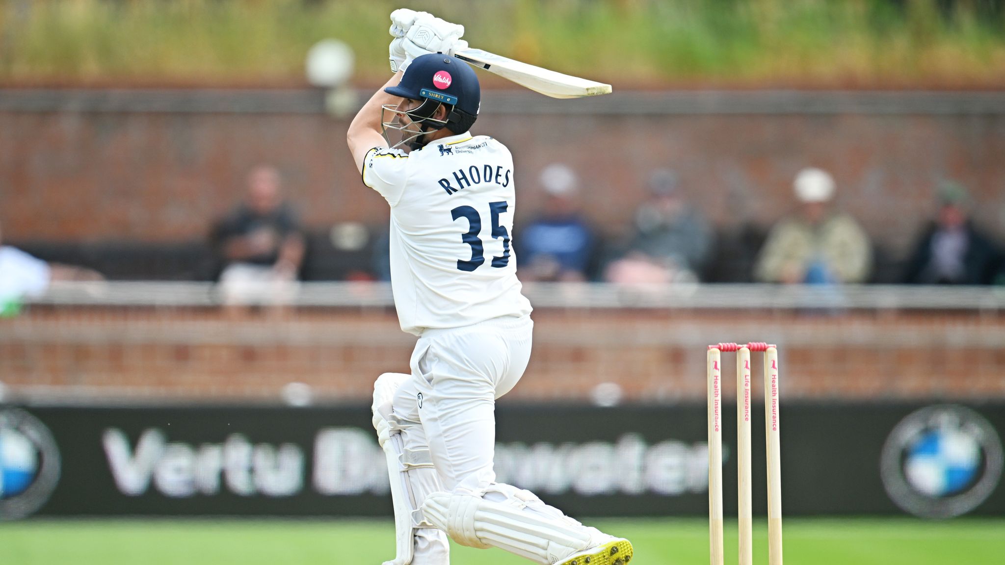 Will Rhodes third century of the season guided Warwickshire to safety in their County Championship draw at Worcestershire