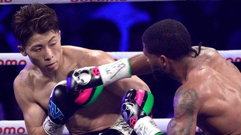 Stephen Fulton, right, of the U.S. throws a punch against Naoya Inoue of Japan during the second round of a boxing match for the unified WBC and WBO super-bantamweight world titles in Tokyo, Tuesday, July 25, 2023. (AP Photo/Hiro Komae)