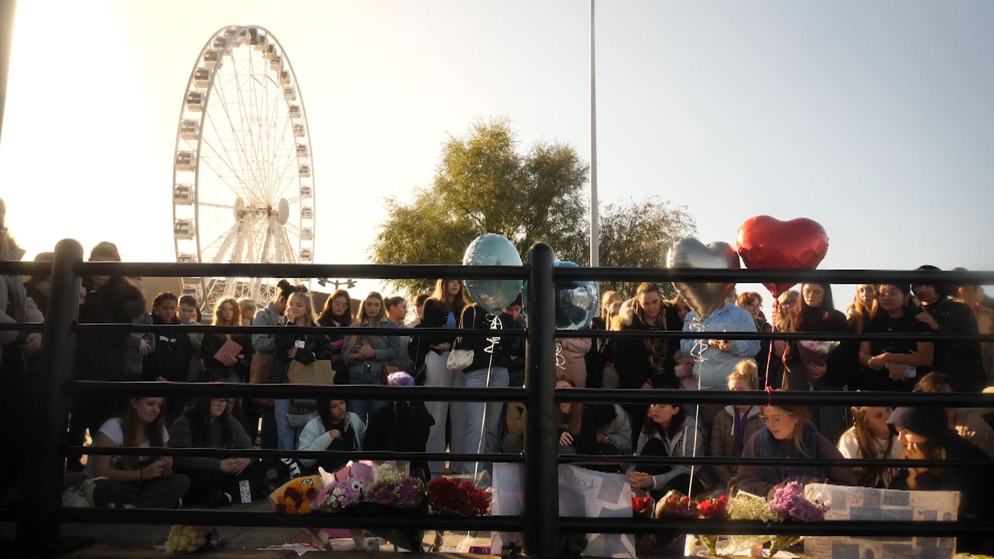 Fans lay flowers and leave balloons for Payne in Liverpool on Sunday