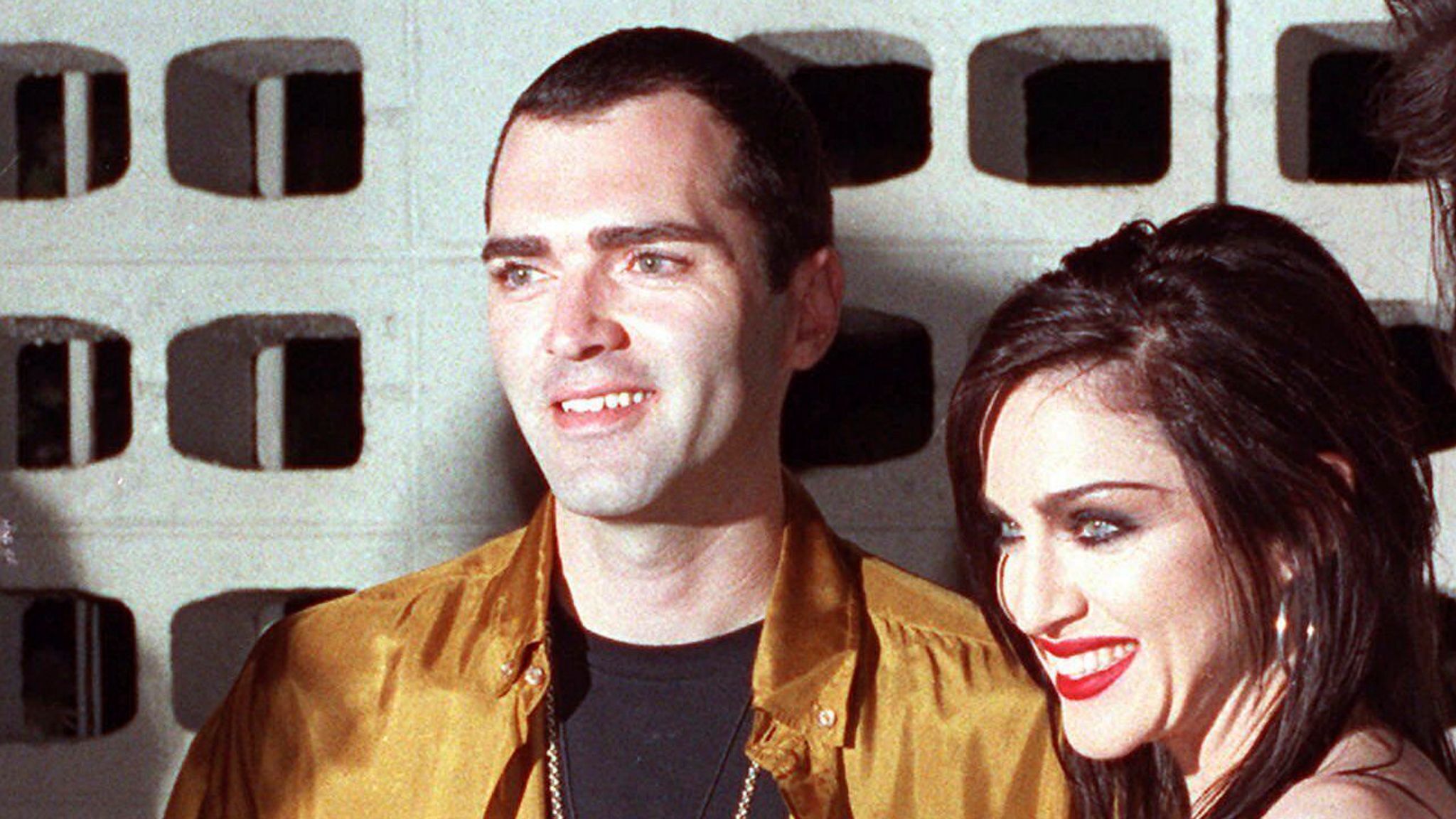 FILE - Madonna poses with her brother, Christopher Ciccone, left, and director Alek Keskishian following the premiere showing of Madonna's newest film, "Truth or Dare," May 7, 1991, in the Hollywood section of Los Angeles. (AP Photo/Julie Markes, File)