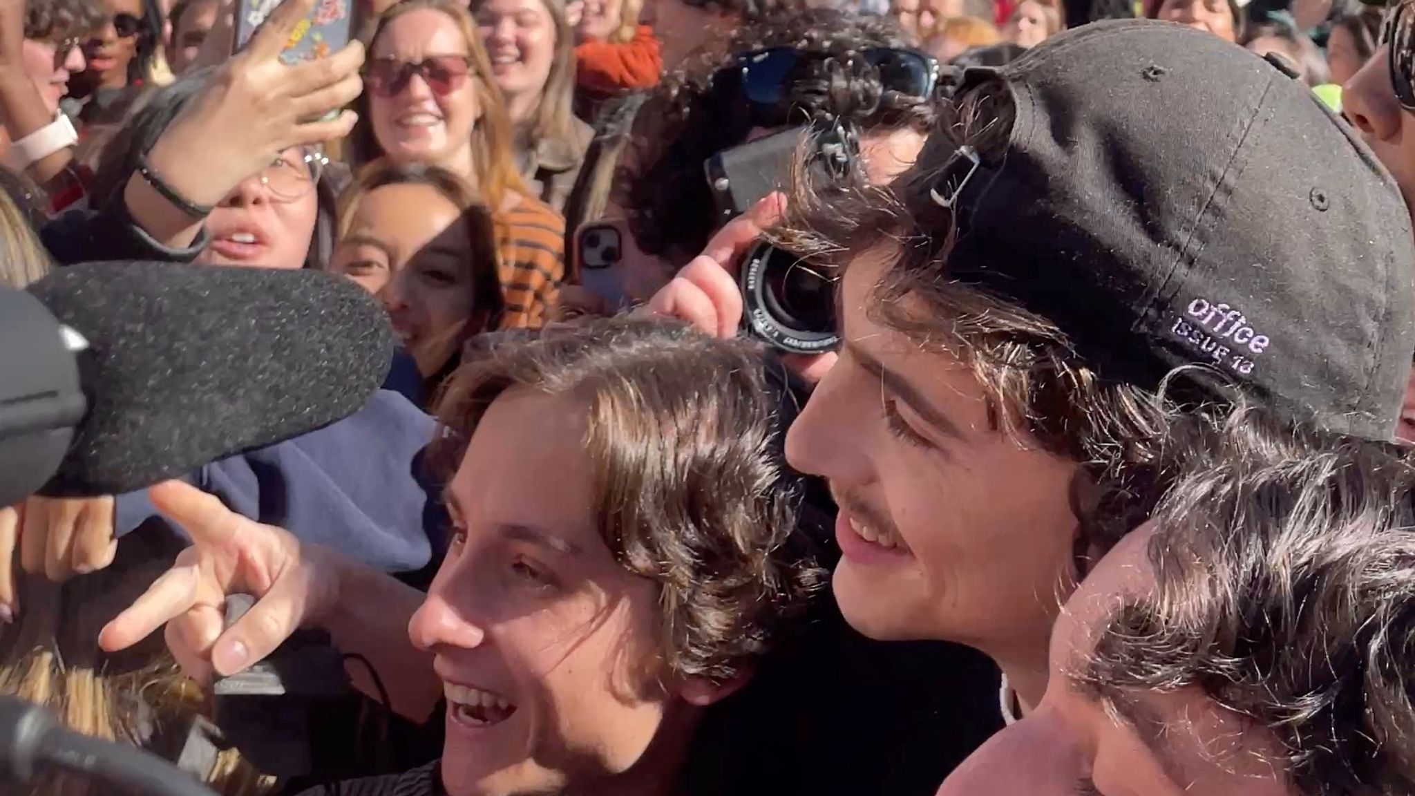 Timothee Chalamet (black cap) poses with contestants. Pic:ITWEETABTTV/Reuters