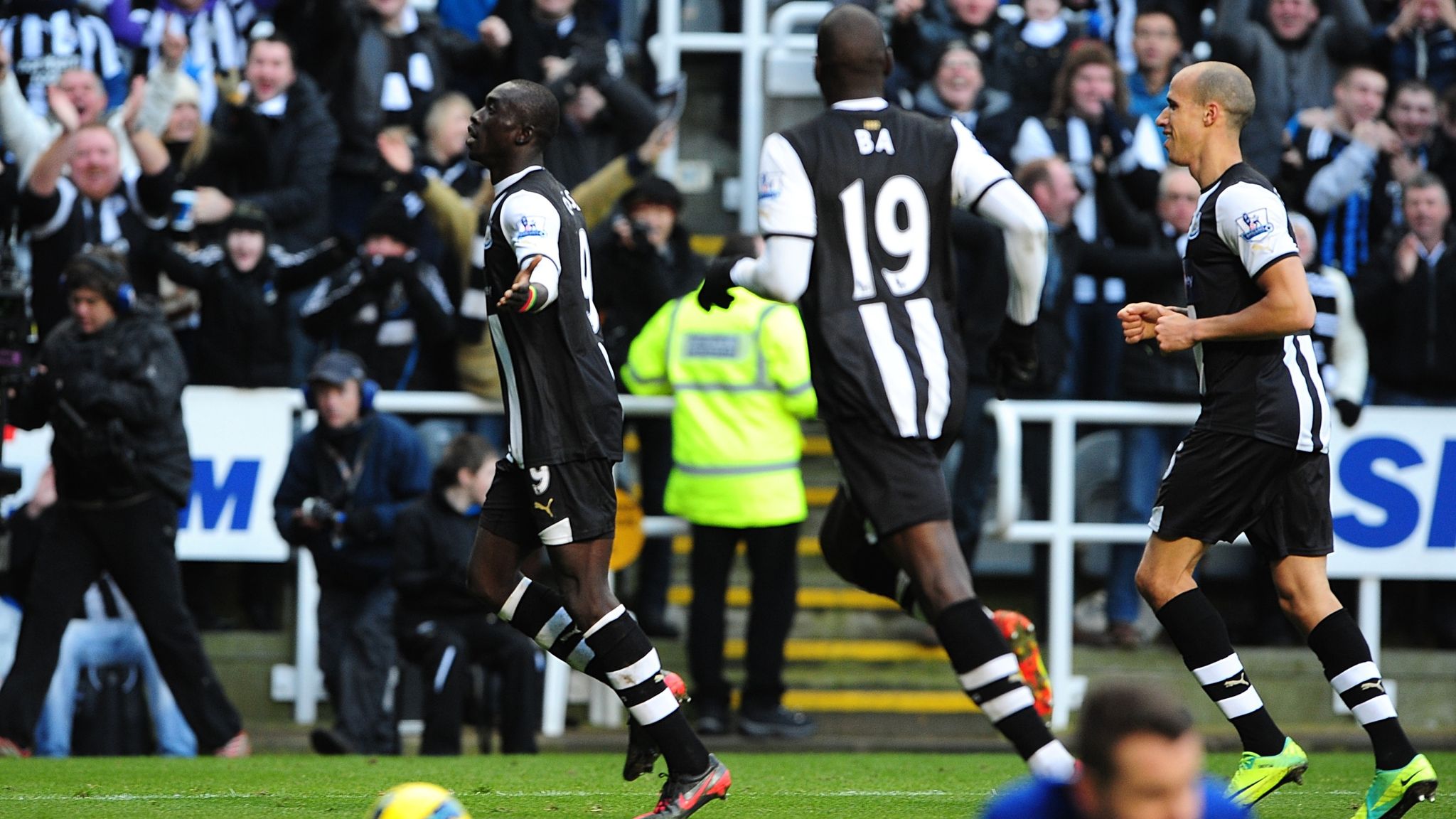 Papiss Cisse celebrates scoring on his debut for Newcastle