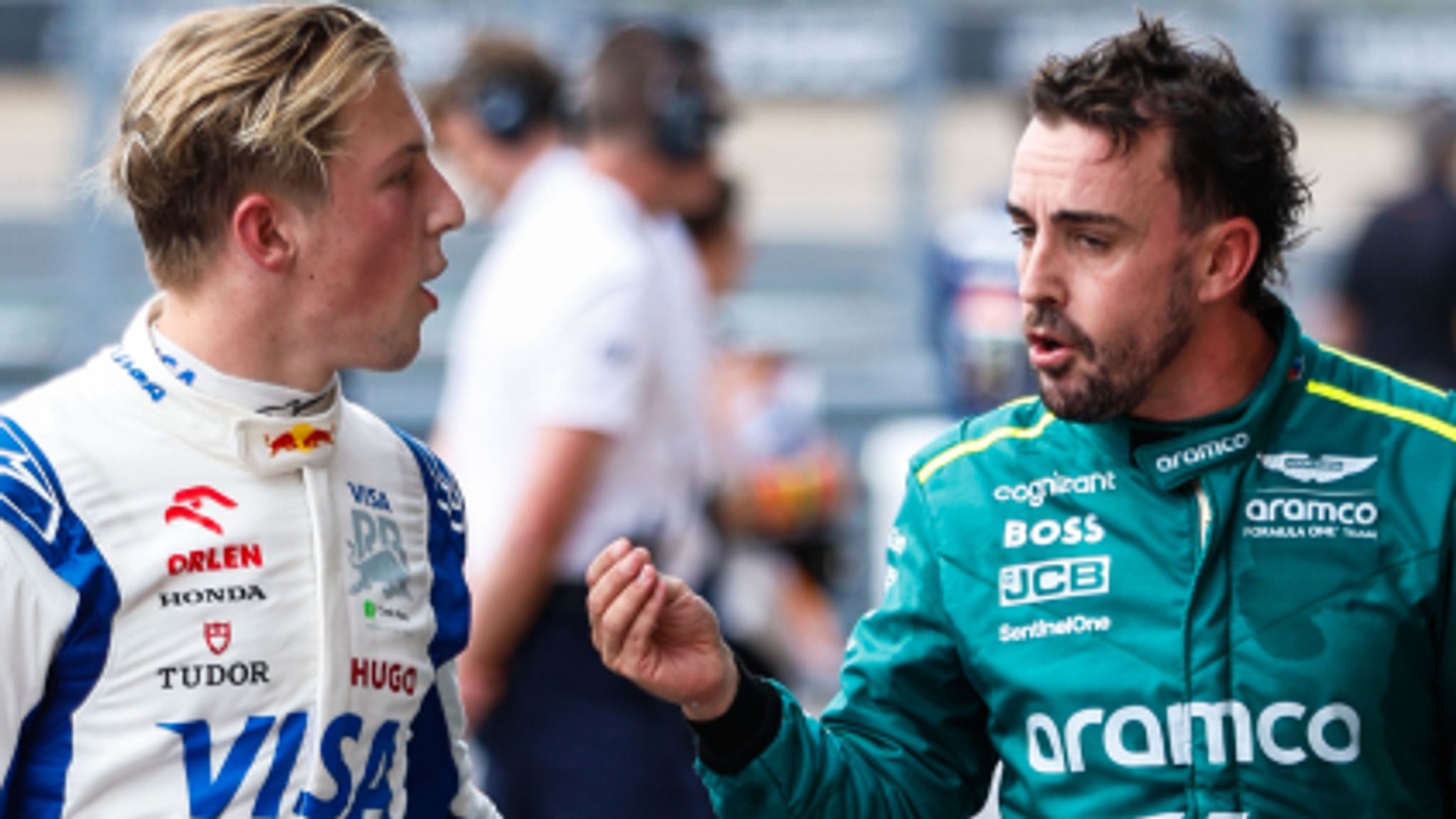 CIRCUIT OF THE AMERICAS, UNITED STATES OF AMERICA - OCTOBER 19: Liam Lawson, Visa Cash App RB F1 Team, and Fernando Alonso, Aston Martin F1 Team, chat in Parc Ferme during the United States GP at Circuit of the Americas on Saturday October 19, 2024 in Austin, United States of America. (Photo by Steven Tee / LAT Images)