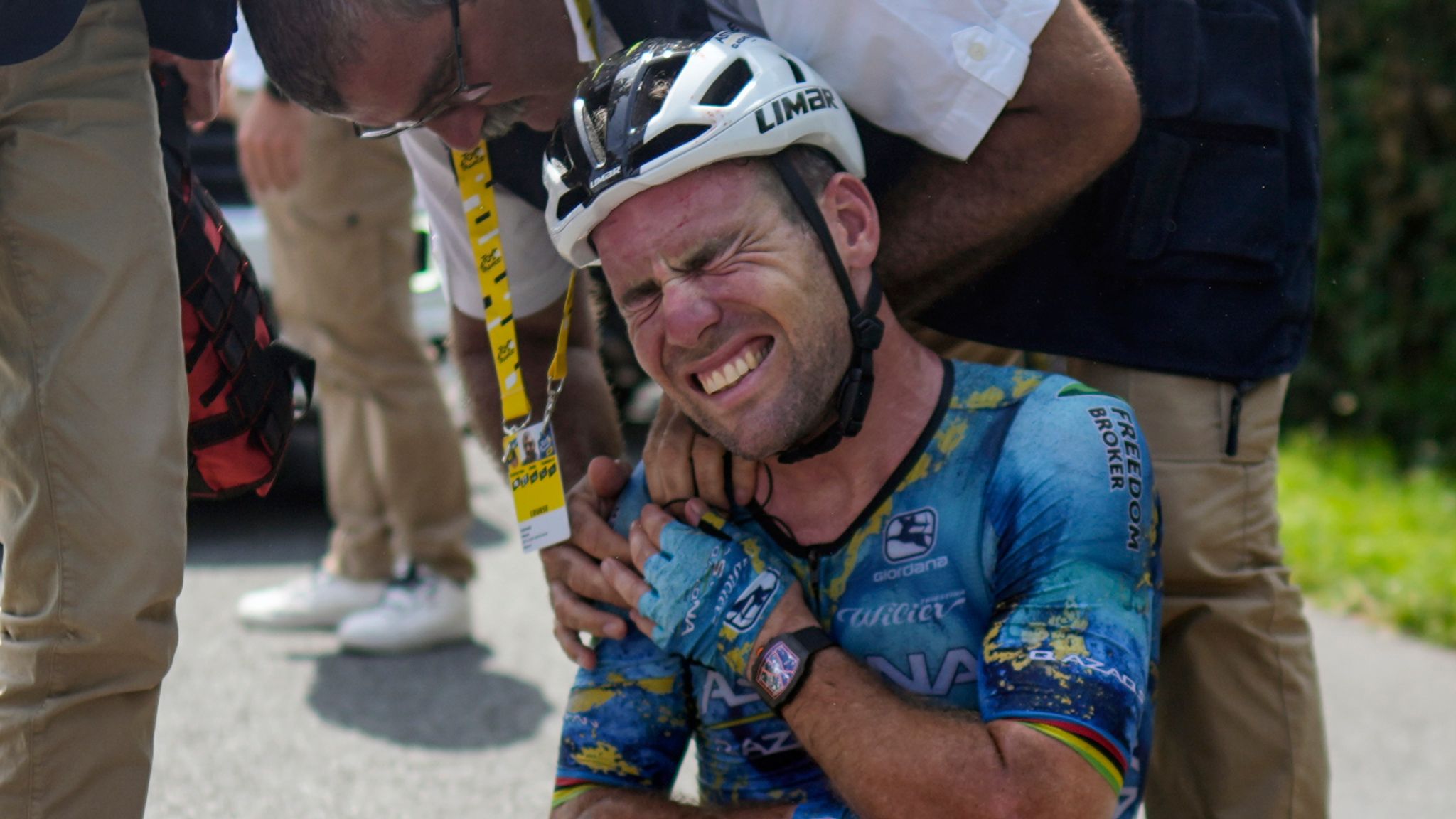 Britain's Mark Cavendish receives medical assistance after crashing during the eighth stage of the 2023 Tour de France (AP)