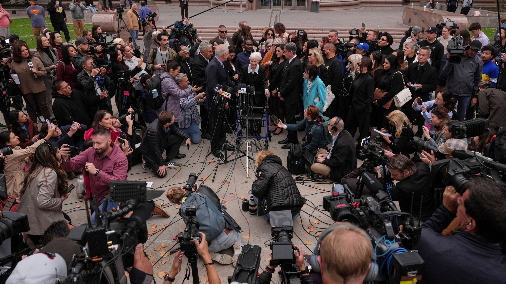 Family members of Erik and Lyle Menendez and their attorneys speak after hearing on 25 November. Pic: AP