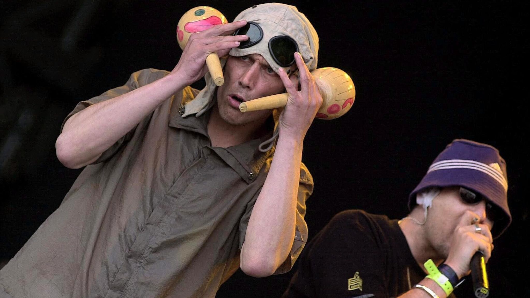 Happy Mondays stars Bez (left) and Shaun Ryder performing at Glastonbury in 2000. Pic: Toby Melville/PA