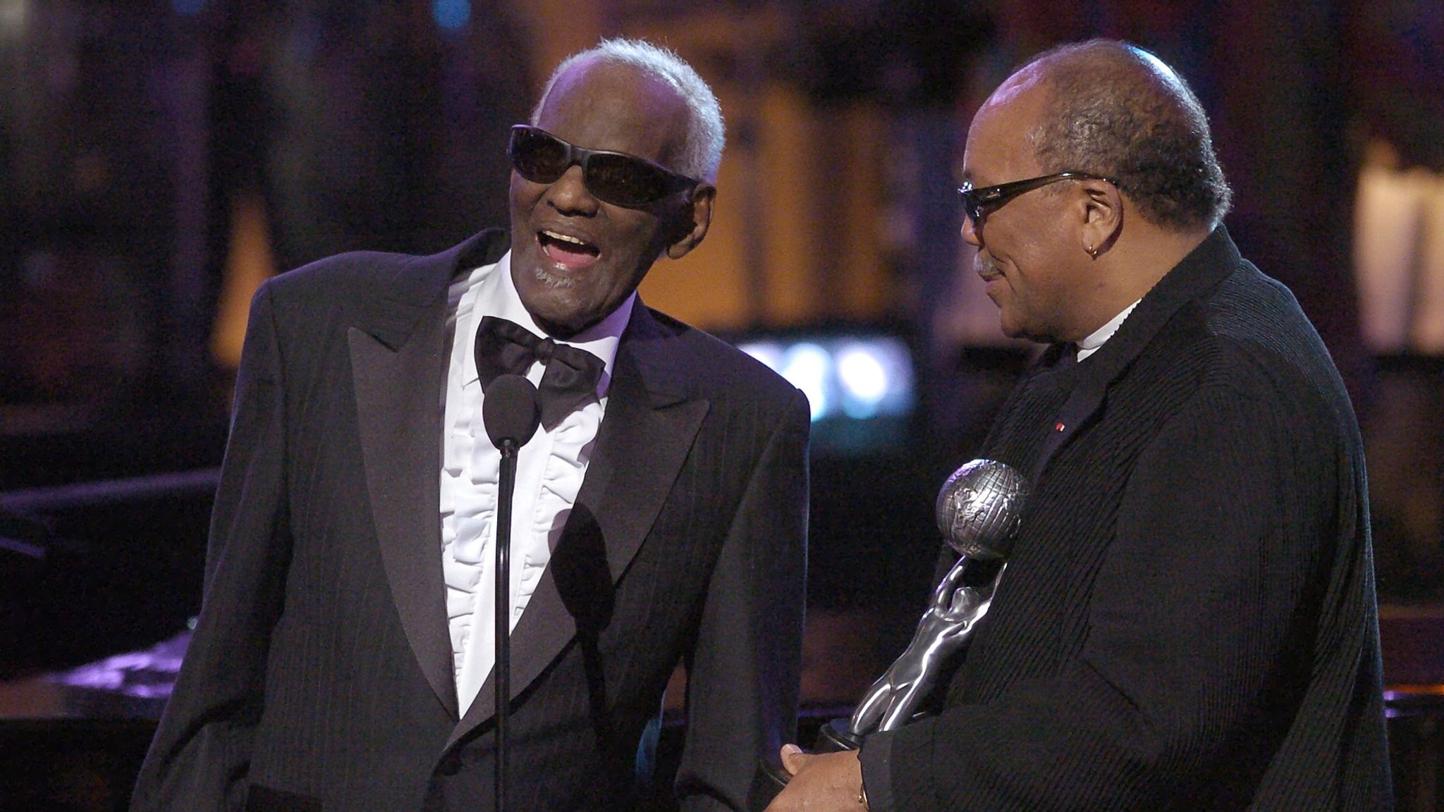 Singer Ray Charles, left, accepts his Hall of Fame award from presenter Quincy Jones at the NAACP Image Awards in March 2004. Pic: AP/Mark J. Terrill