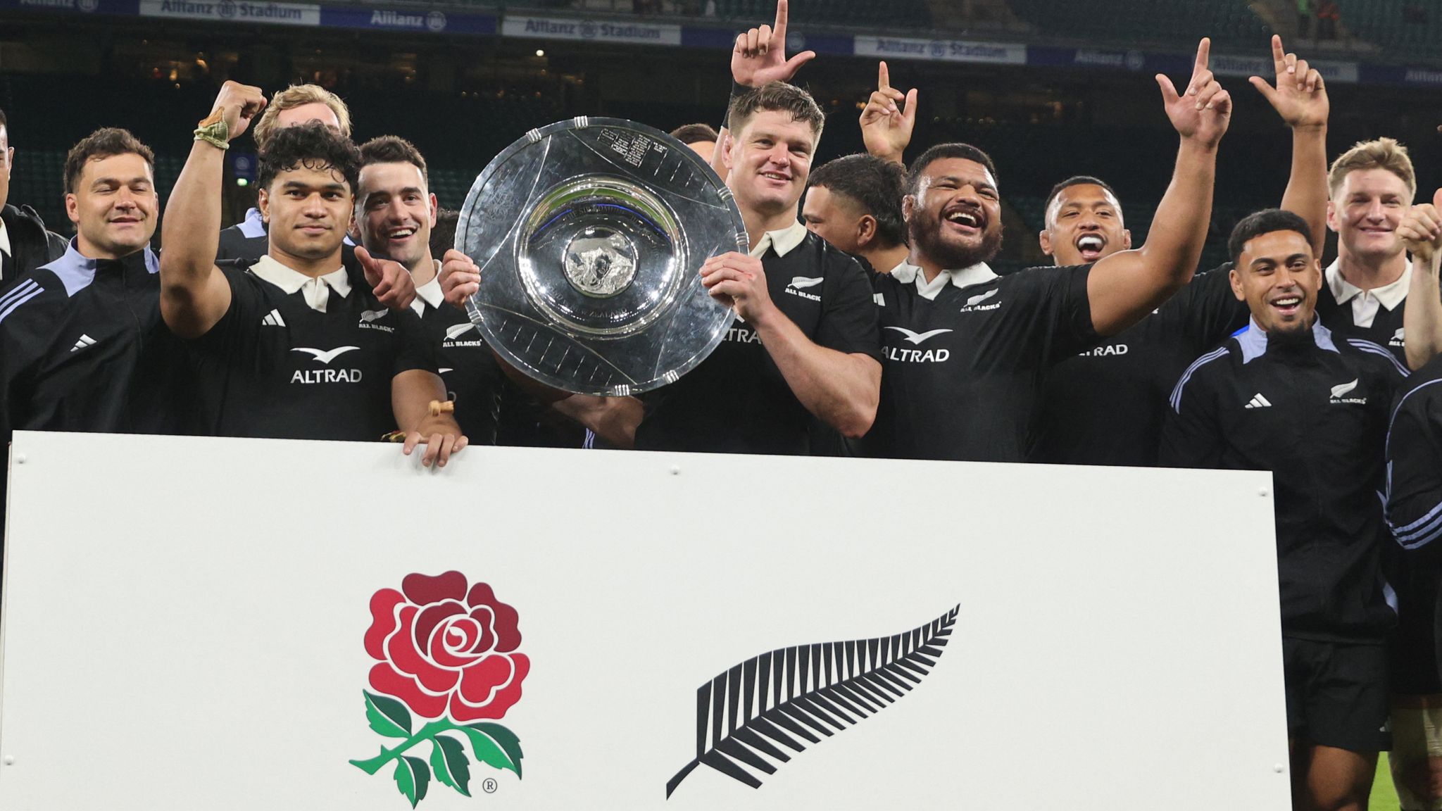 New Zealand's players celebrate with the trophy after the Autumn Nations Series International rugby union test match between England and New Zealand at the Allianz Stadium, Twickenham in south-west London, on November 2, 2024. New Zealand won the game 24-22. (Photo by Adrian DENNIS / AFP)