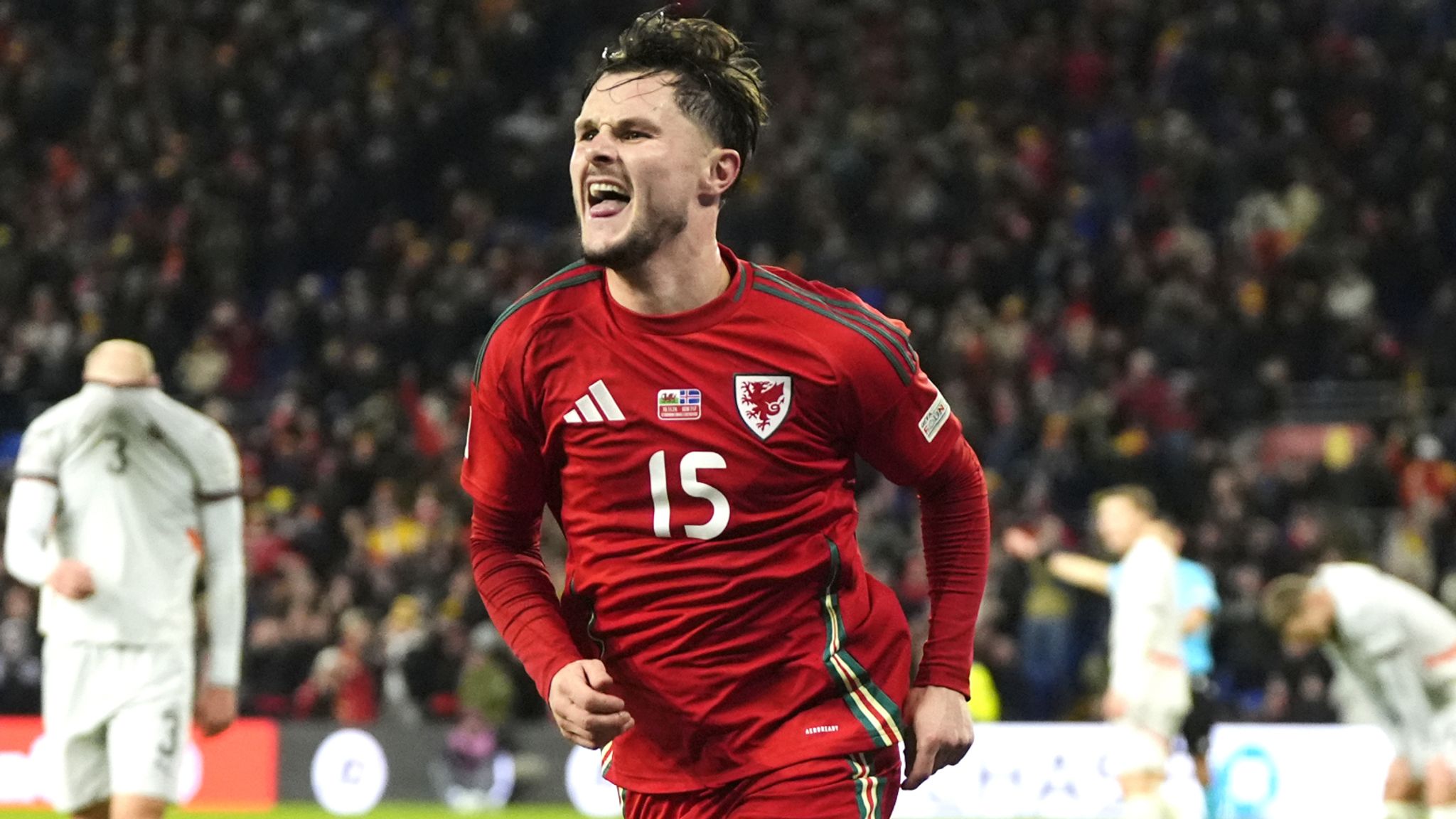 Liam Cullen celebrates scoring his second goal for Wales against Iceland