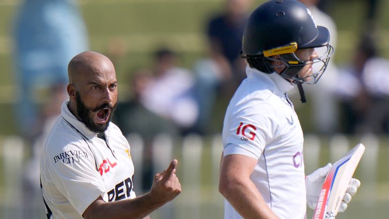 Pakistan&#39;s Sajid Khan, left, celebrates after taking the wicket of England&#39;s Ollie Pope, right, during the day one of third test cricket match between Pakistan and England, in Rawalpindi, Pakistan, Thursday, Oct. 24, 2024. (AP Photo/Anjum Naveed)