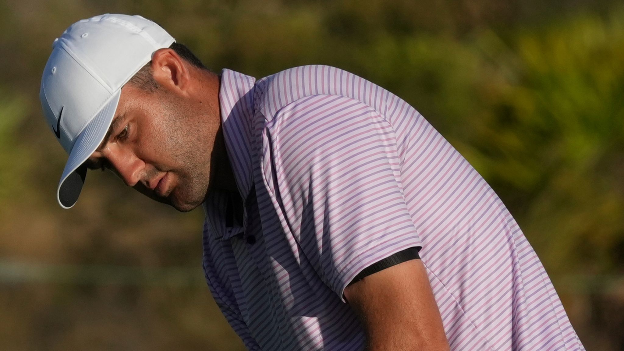 Scottie Scheffler, of the United States, watches his putt on the 18th green during the second round of the Hero World Challenge PGA Tour at the Albany Golf Club in New Providence, Bahamas, Friday, Dec. 6, 2024. (AP Photo/Fernando Llano)