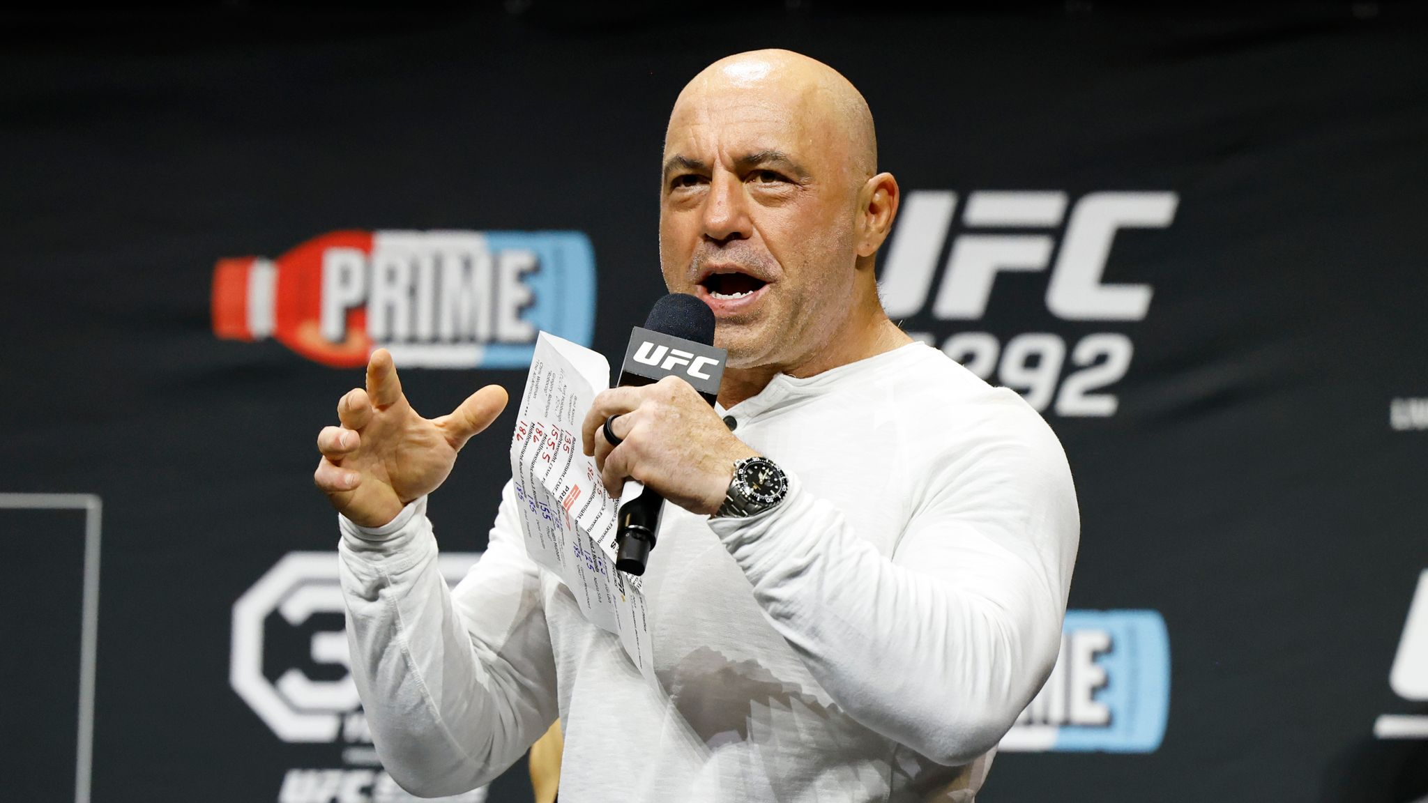 Joe Rogan is seen at the ceremonial weigh-in for the UFC 292 mixed martial arts event, Friday, August 18, 2023, in Boston. (AP Photo/Gregory Payan)