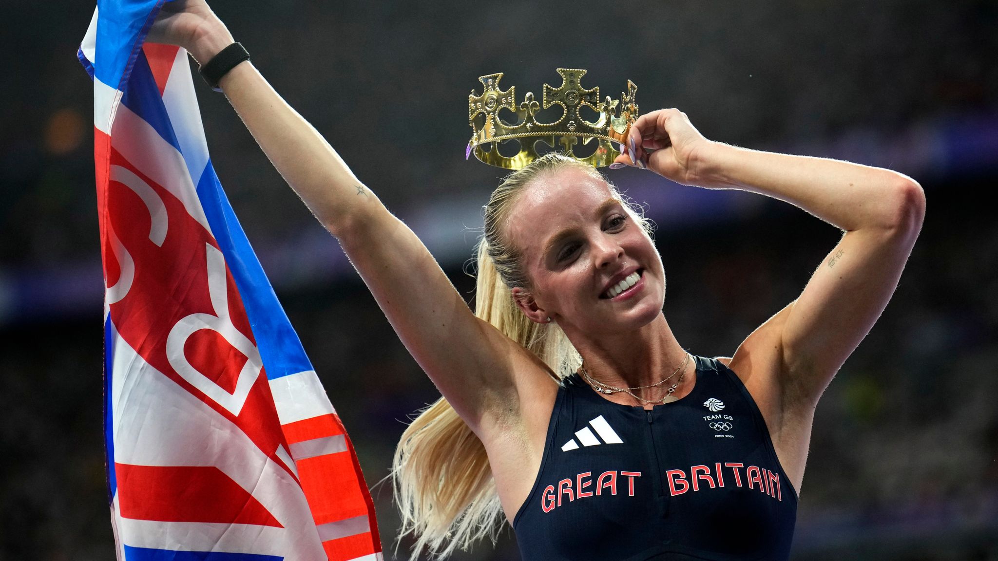 Keely Hodgkinson, of Britain, celebrates after winning the women's 800-meters final at the 2024 Summer Olympics, Monday, Aug. 5, 2024, in Saint-Denis, France. (AP Photo/Petr David Josek)