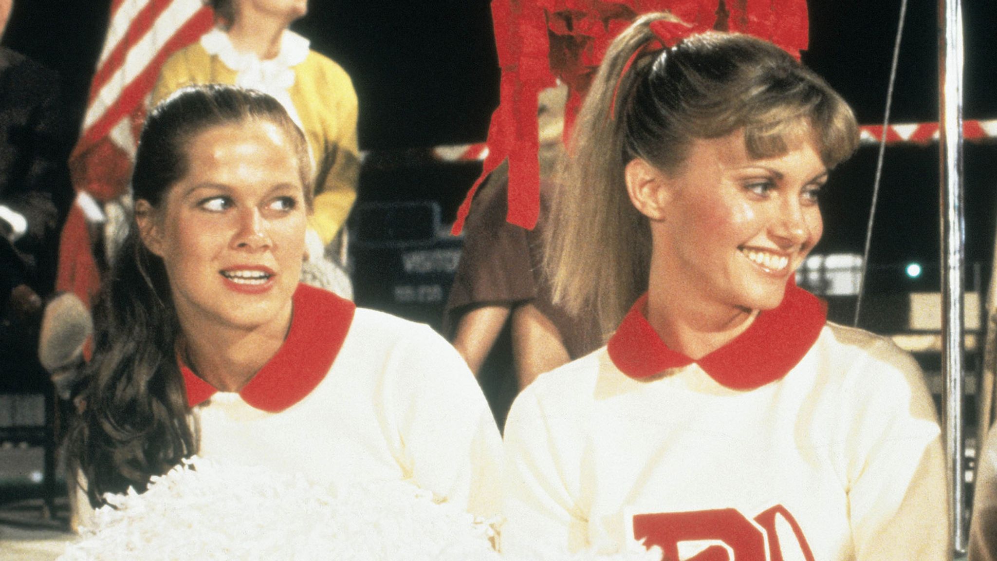 Susan Buckner, left, with Olivia Newton-John in Grease. Pic: Moviestore/Shutterstock