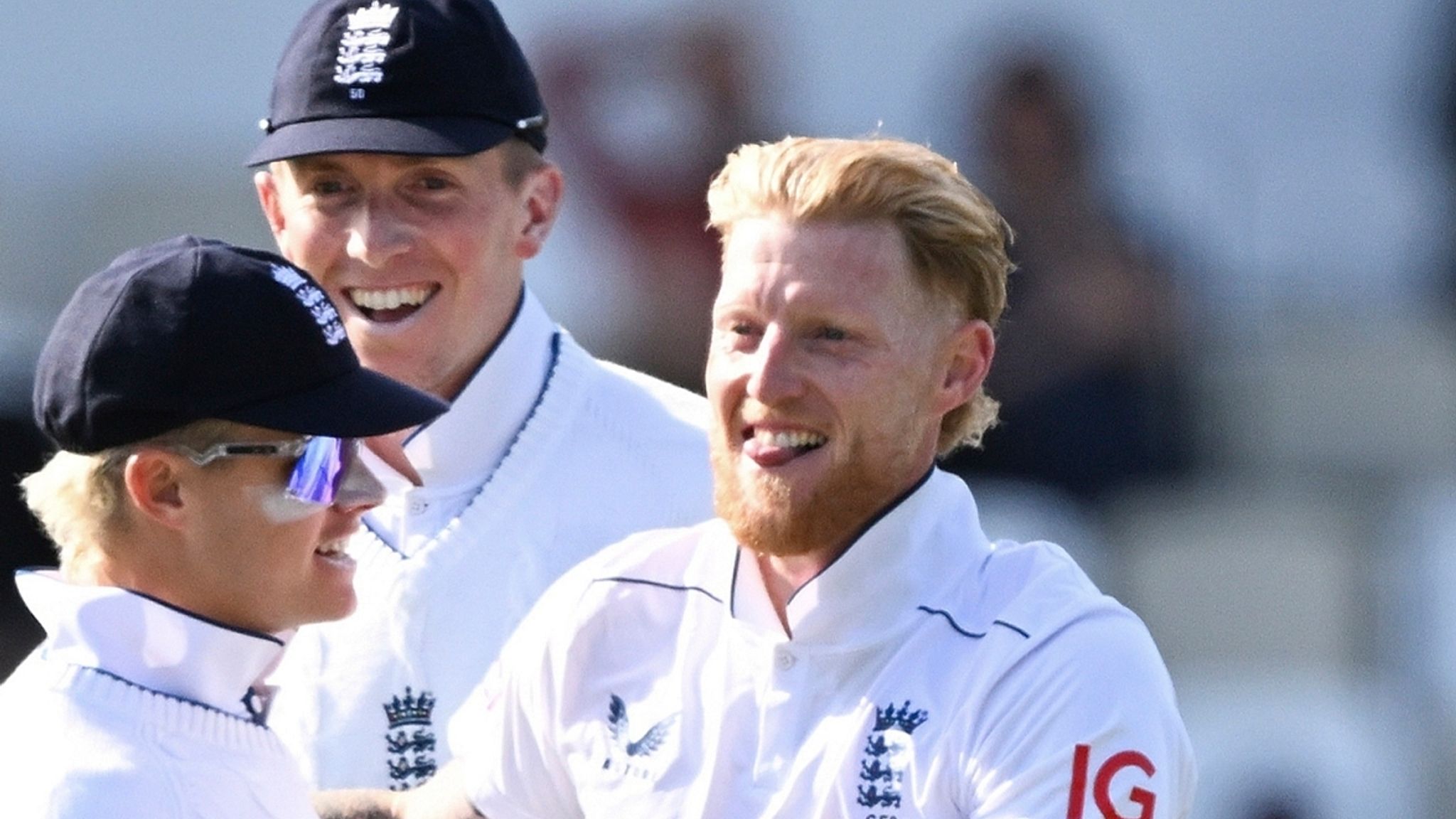 England's Ben Stokes, right, is congratulated by teammates after taking the wicket of New Zealand's Tom Latham during play on day one of the second cricket test between New Zealand and England at the Basin Reserve in Wellington, New Zealand, Friday, Dec.6, 2024. (Andrew Cornaga/Photosport via AP)