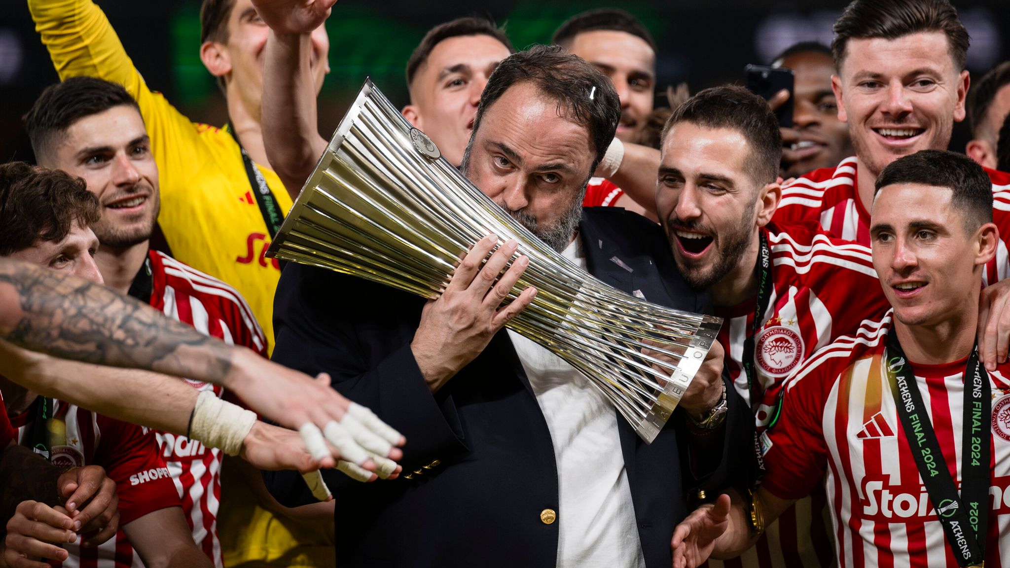 Evangelos Marinakis celebrates with the Europa Conference League trophy