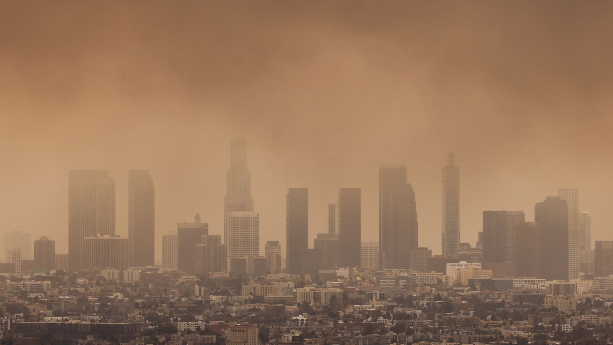 The skyline of Los Angeles covered with smoke due to wildfires raging in the area. Pic: Reuters