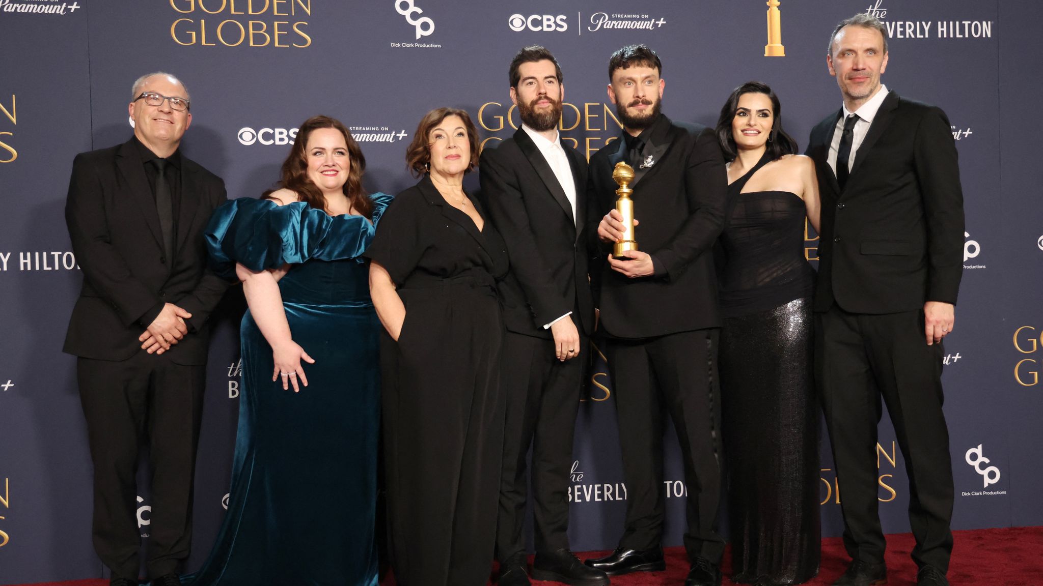 Wim De Greef, Jessica Gunning, Petra Fried, Ed McDonald, Richard Gadd, Nava Mau, and Matt Jarvis pick up the award for best limited TV series for Baby Reindeer at the Golden Globes. Pic: Reuters/Mario Anzuoni