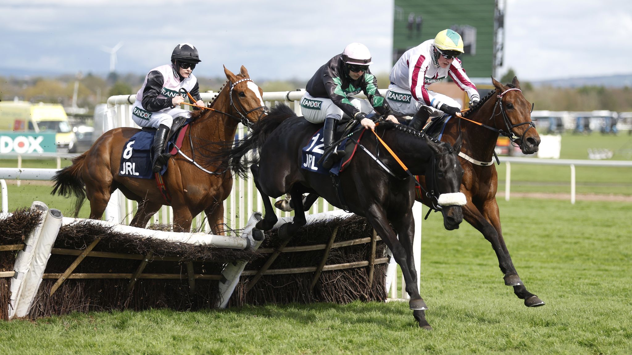 Strong Leader (black and green) on the way to winning the Liverpool Hurdle