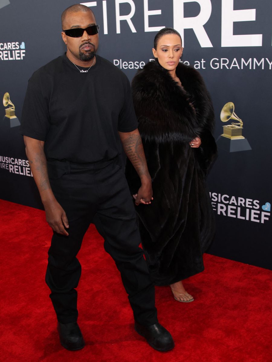 Kanye West and Bianca Censori, who later stripped off her fur coat to reveal a very sheer dress... Pic: Reuters