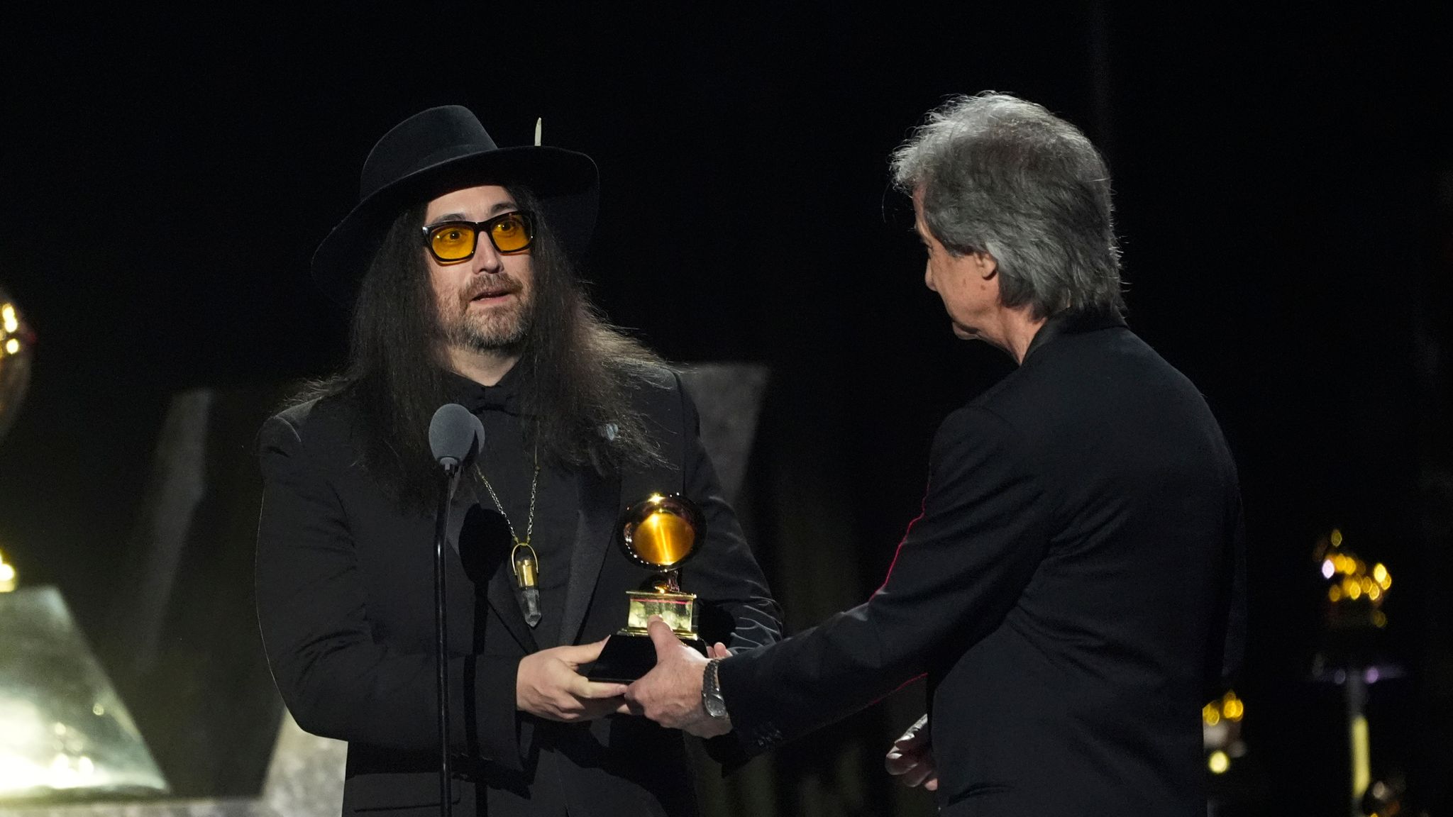 Sean Ono Lennon, left, accepts the award for best rock performance from producer Bob Clearmountain, for Now And Then on behalf of The Beatles, during the 2025 Grammy Awards. Pic: AP/Chris Pizzello